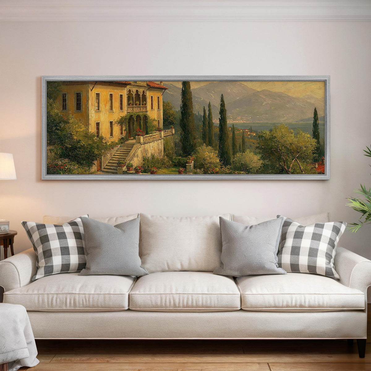 Tuscan villa among cypress hills panoramic canvas print above a white sofa in a bright living room