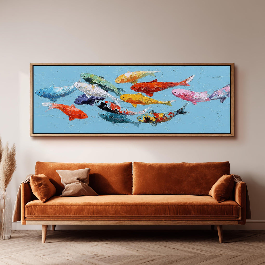 a large painting of colorful fish swimming in a blue background, hanging on a wall above a brown sofa.