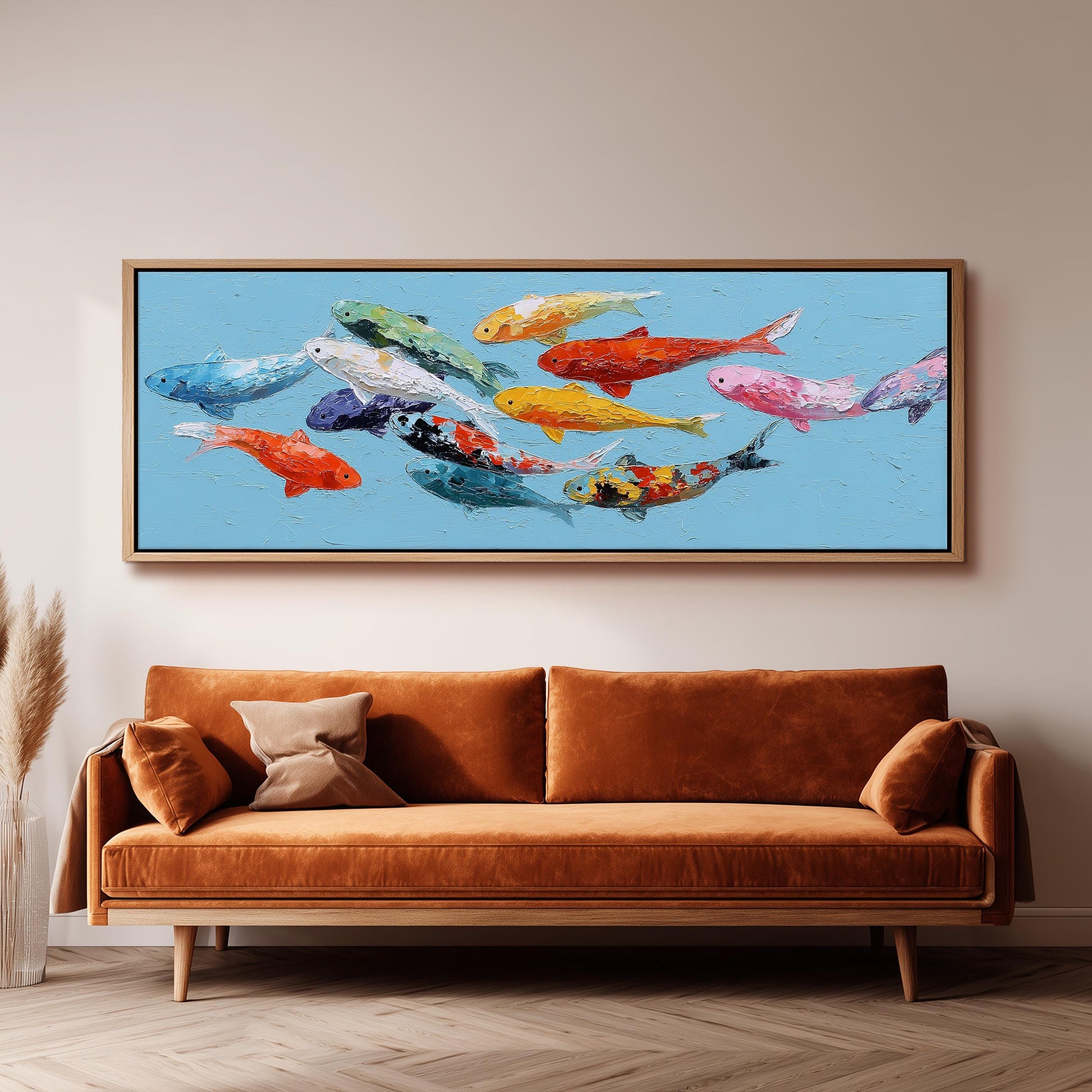 a large painting of colorful fish swimming in a blue background, hanging on a wall above a brown sofa.