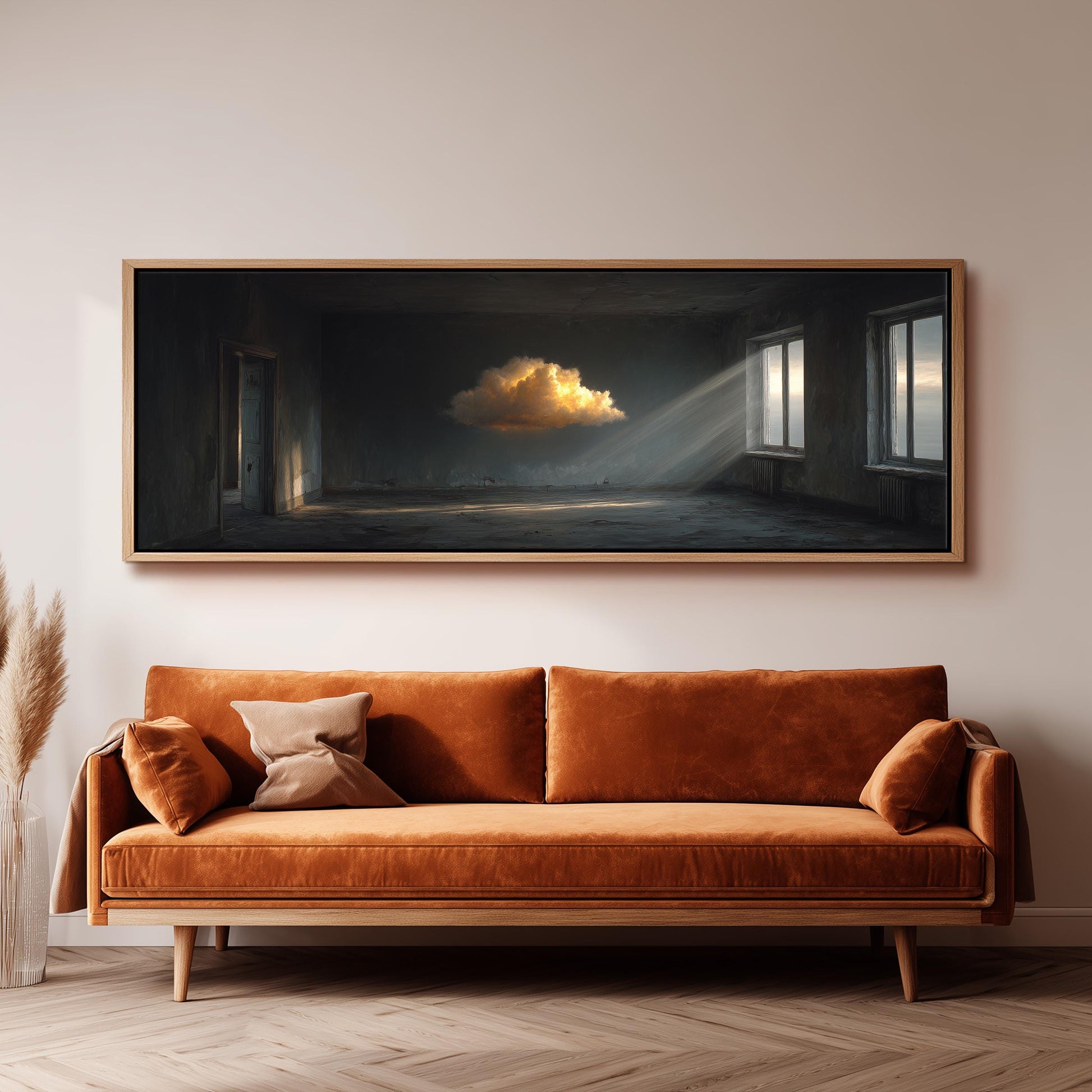 a large, rectangular painting hanging on a wall above a brown sofa.