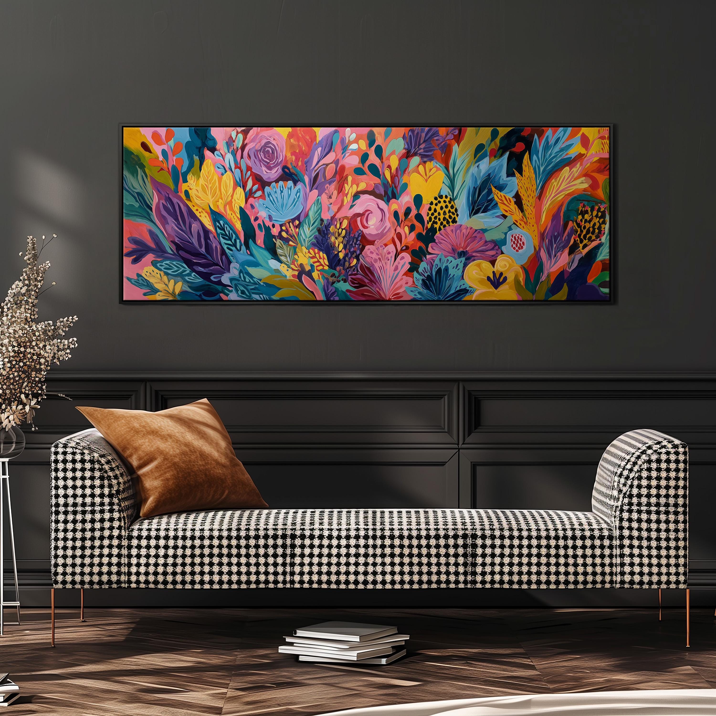 a large, colorful painting of flowers and foliage hanging on a wall above a black and white checkered sofa.