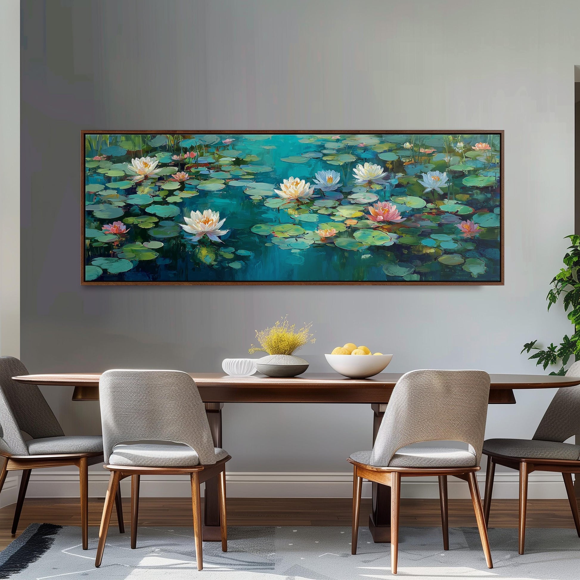 a large painting of lily pads hanging on a wall above a wooden dining table with four chairs. The painting depicts a serene scene of lily pads floating on a tranquil body of water, creating a peaceful and calming atmosphere.