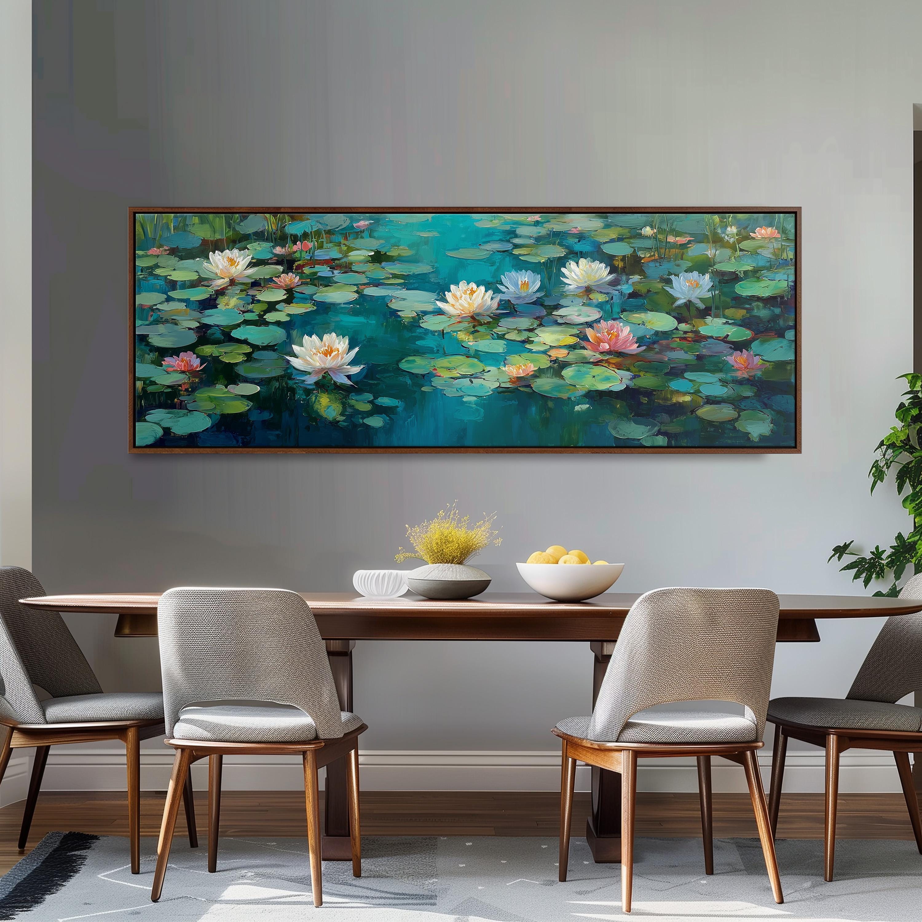 a large painting of lily pads hanging on a wall above a wooden dining table with four chairs. The painting depicts a serene scene of lily pads floating on a tranquil body of water, creating a peaceful and calming atmosphere.