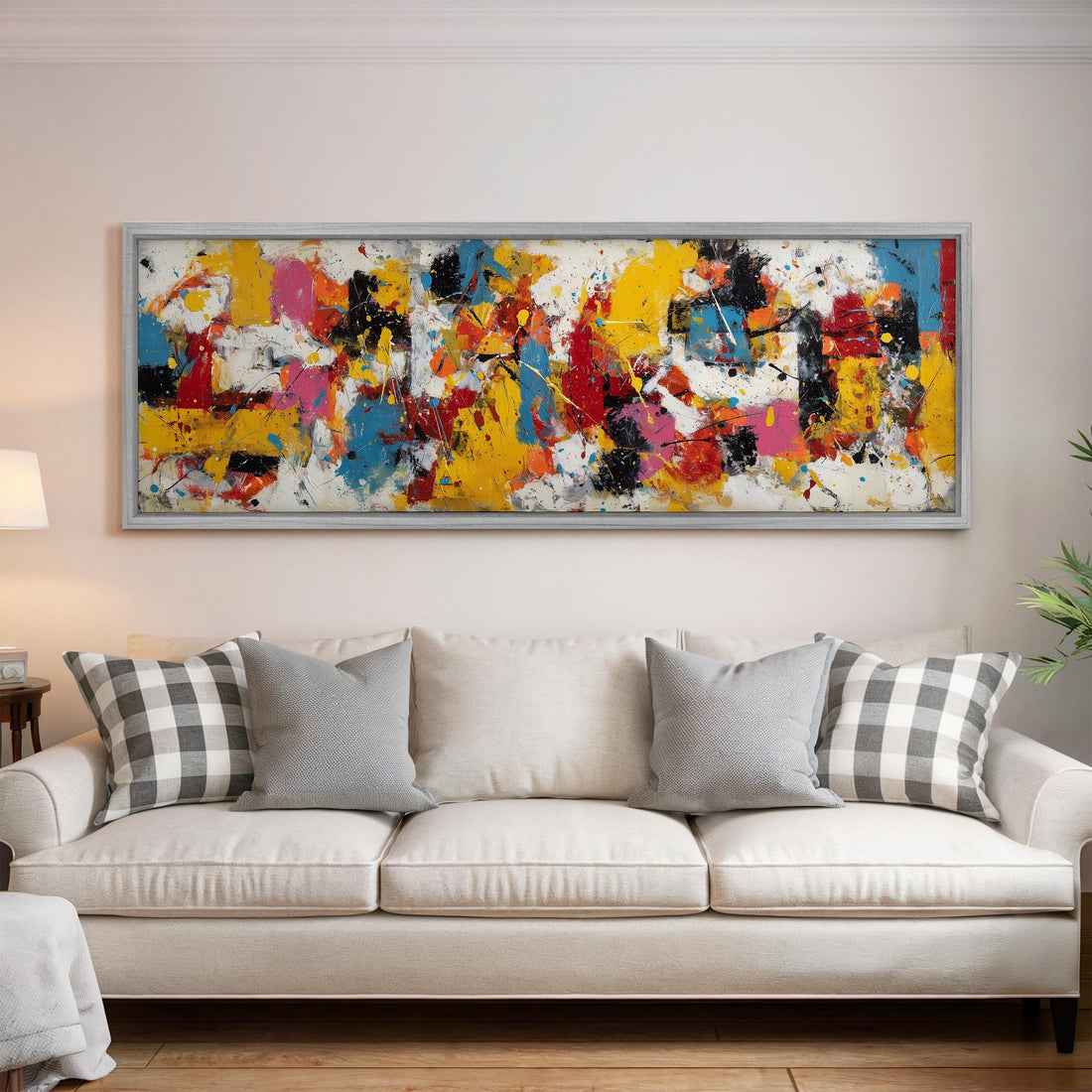 a modern living room with a black and white checkered sofa, a stack of books, and a large abstract painting hanging on the wall above the sofa.