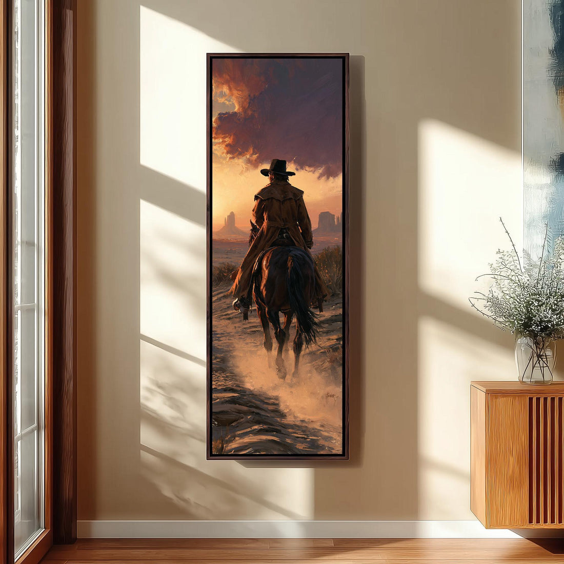 Cowboy riding through Monument Valley at sunset long vertical canvas print in a sunlit living space