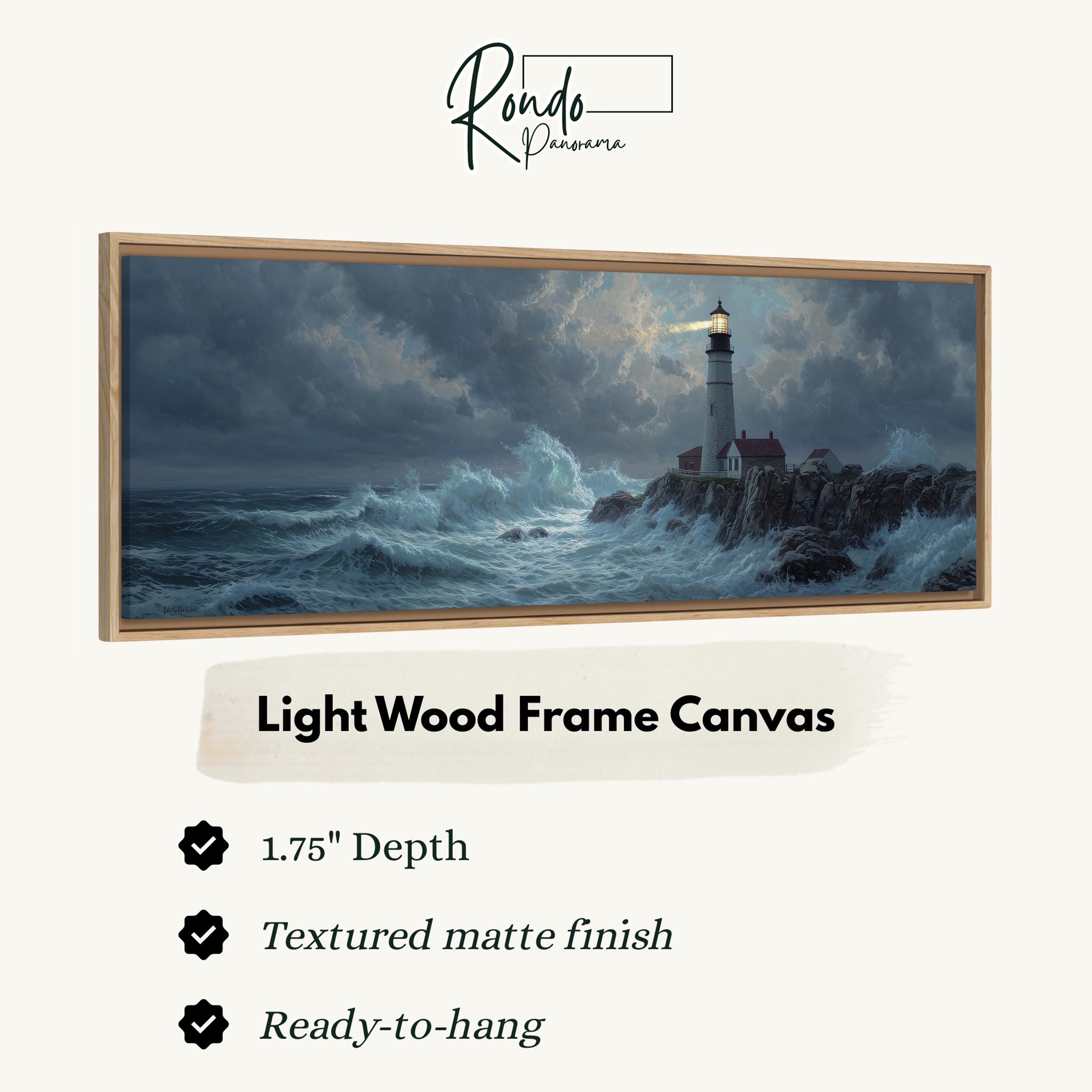 The image is a framed canvas depicting a lighthouse on a rocky shore during a stormy night.