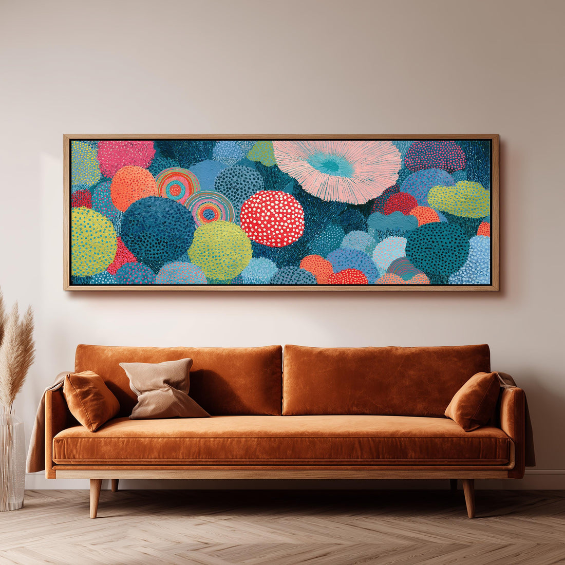 Coral spirals and dotted circles long horizontal canvas print above a sofa in a living room