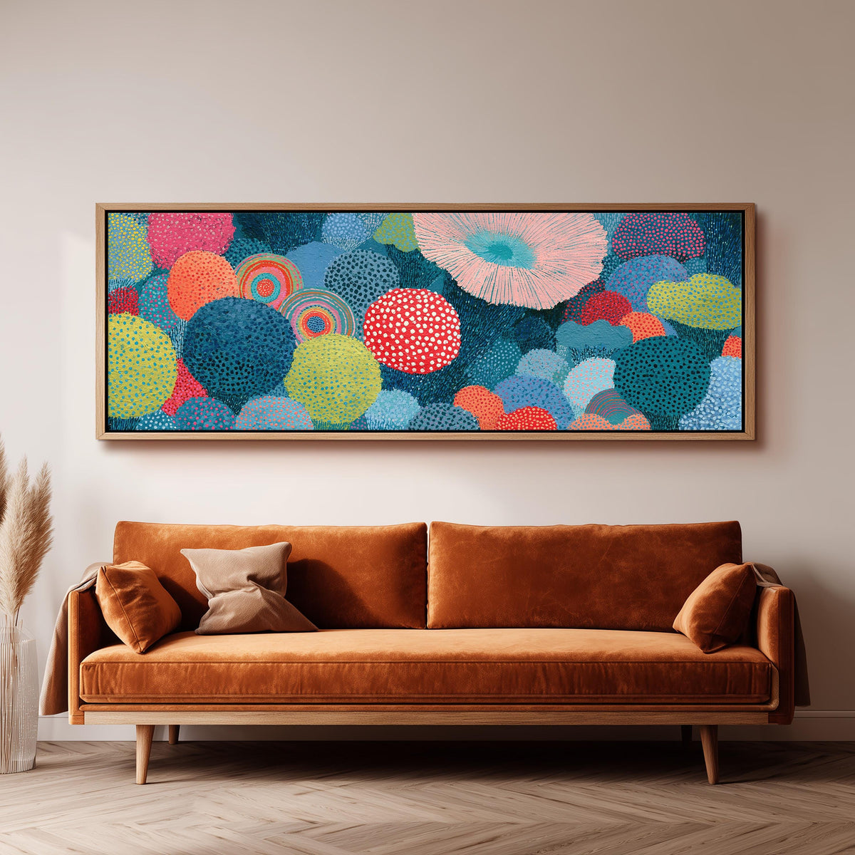 Coral spirals and dotted circles long horizontal canvas print above a sofa in a living room