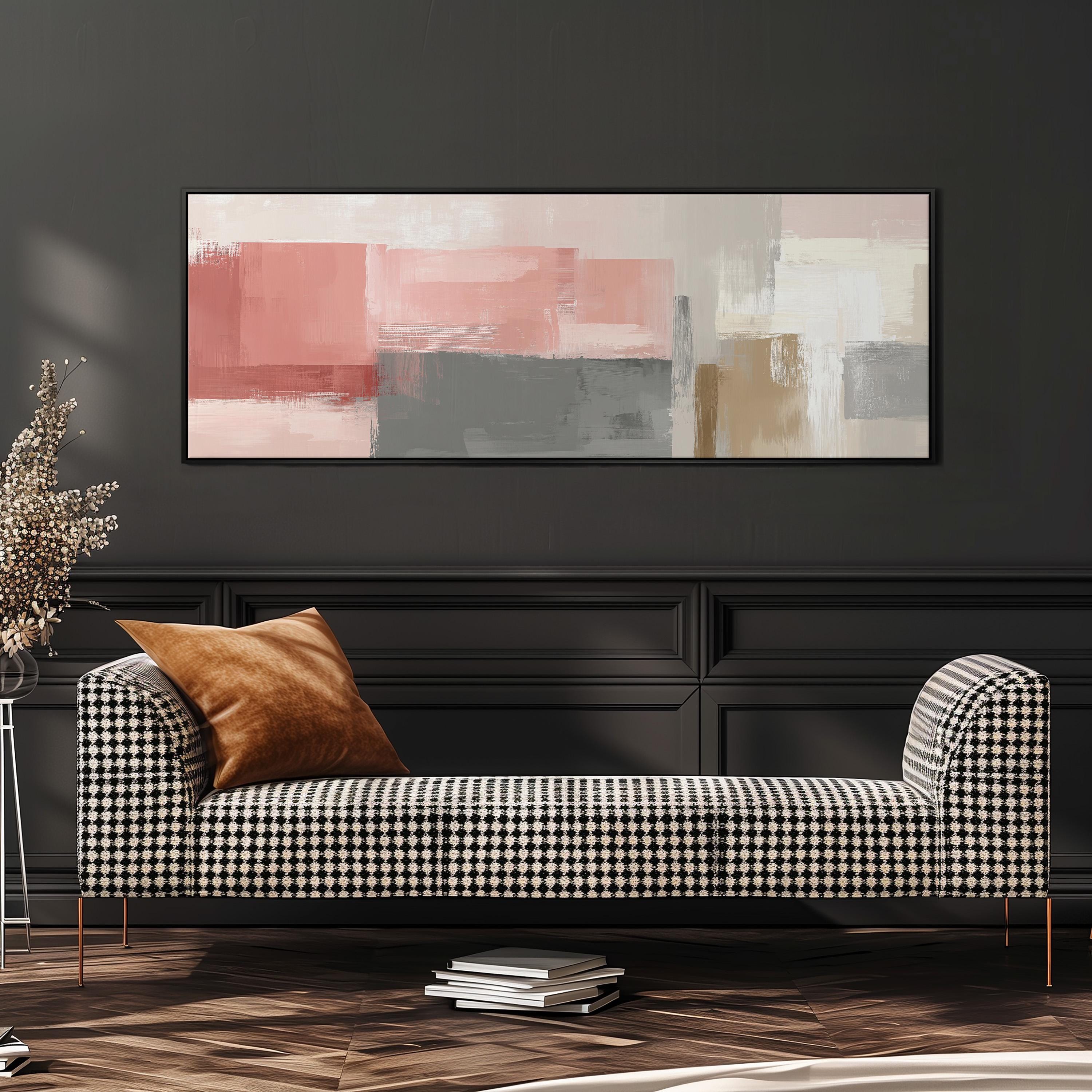 a modern living room with a black and white checkered sofa, a large abstract painting on the wall, and a stack of books on the floor.