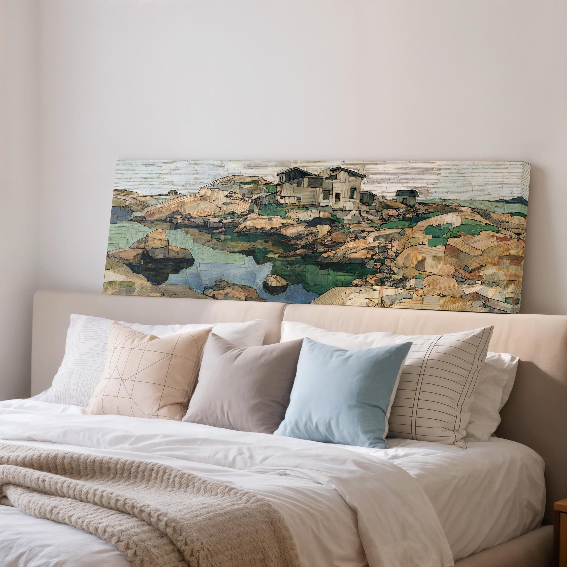 a large painting of a coastal landscape hanging on the wall above a bed with white bedding and pillows.
