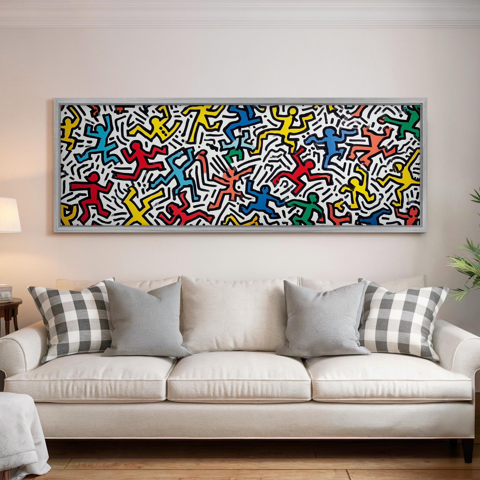 a large, colorful abstract painting hanging on a wall above a white couch with gray and black plaid throw pillows.