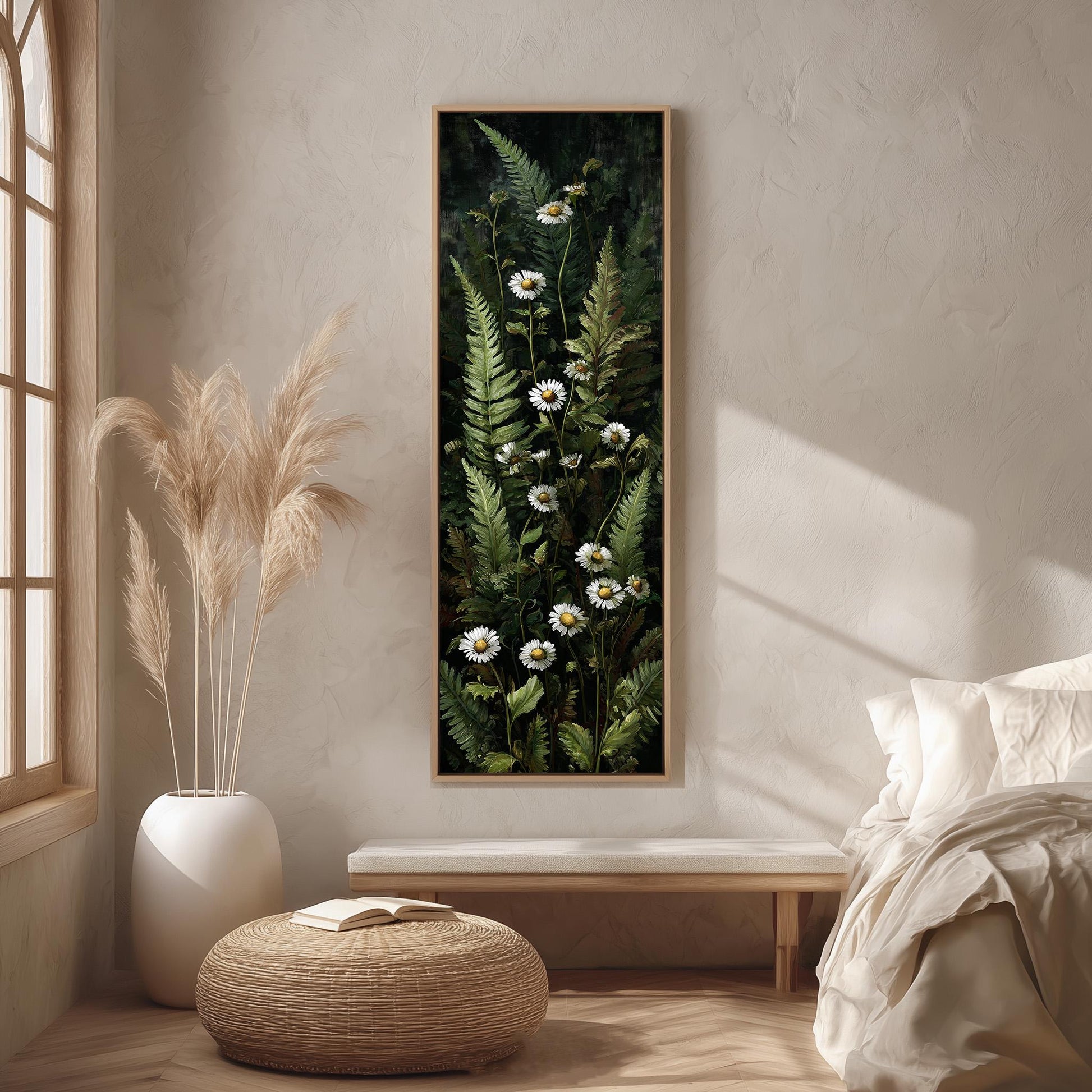 a serene and cozy bedroom scene, featuring a large framed painting of lush green ferns and white daisies hanging on the wall. The painting is the focal point of the room, which is adorned with a white bed, a wooden bench, and a woven ottoman. The room is bathed in soft, natural light that accentuates the tranquil atmosphere and the vibrant colors of the painting.