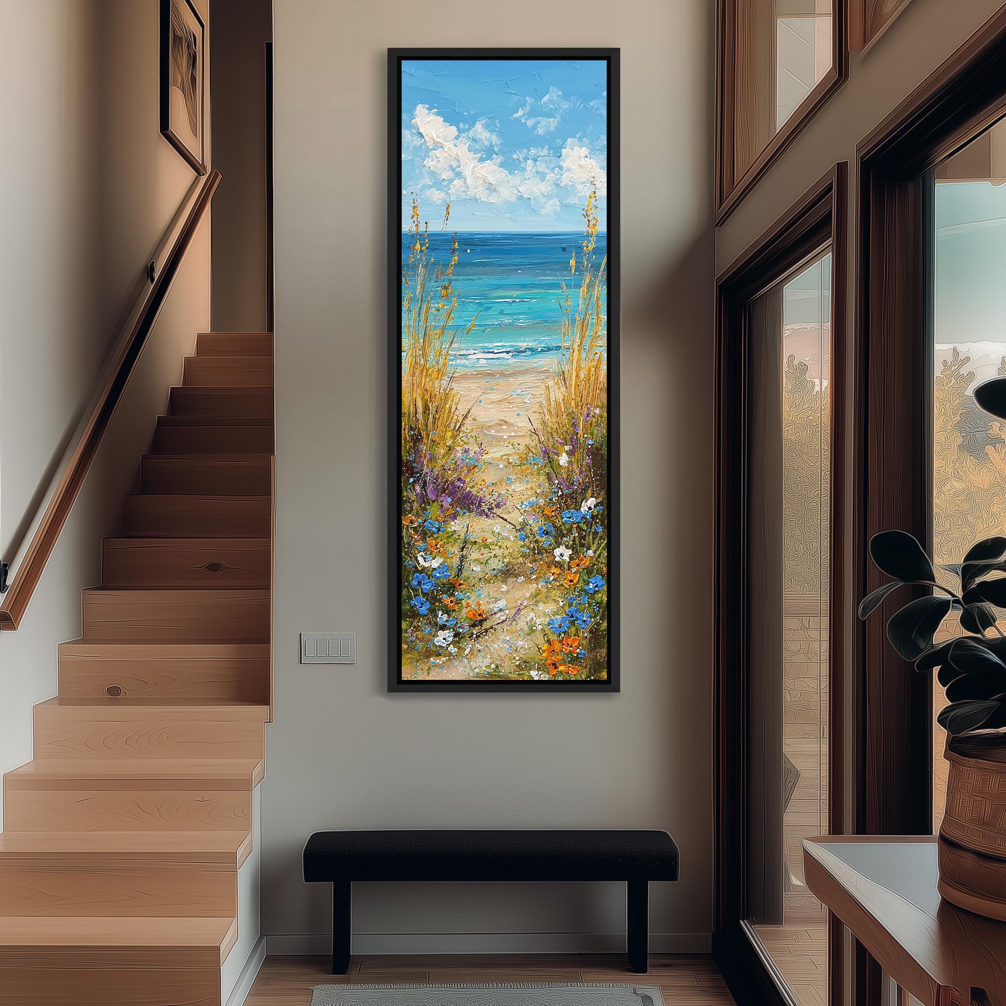 a large painting of a beach scene hanging on the wall, with a staircase leading up to it.