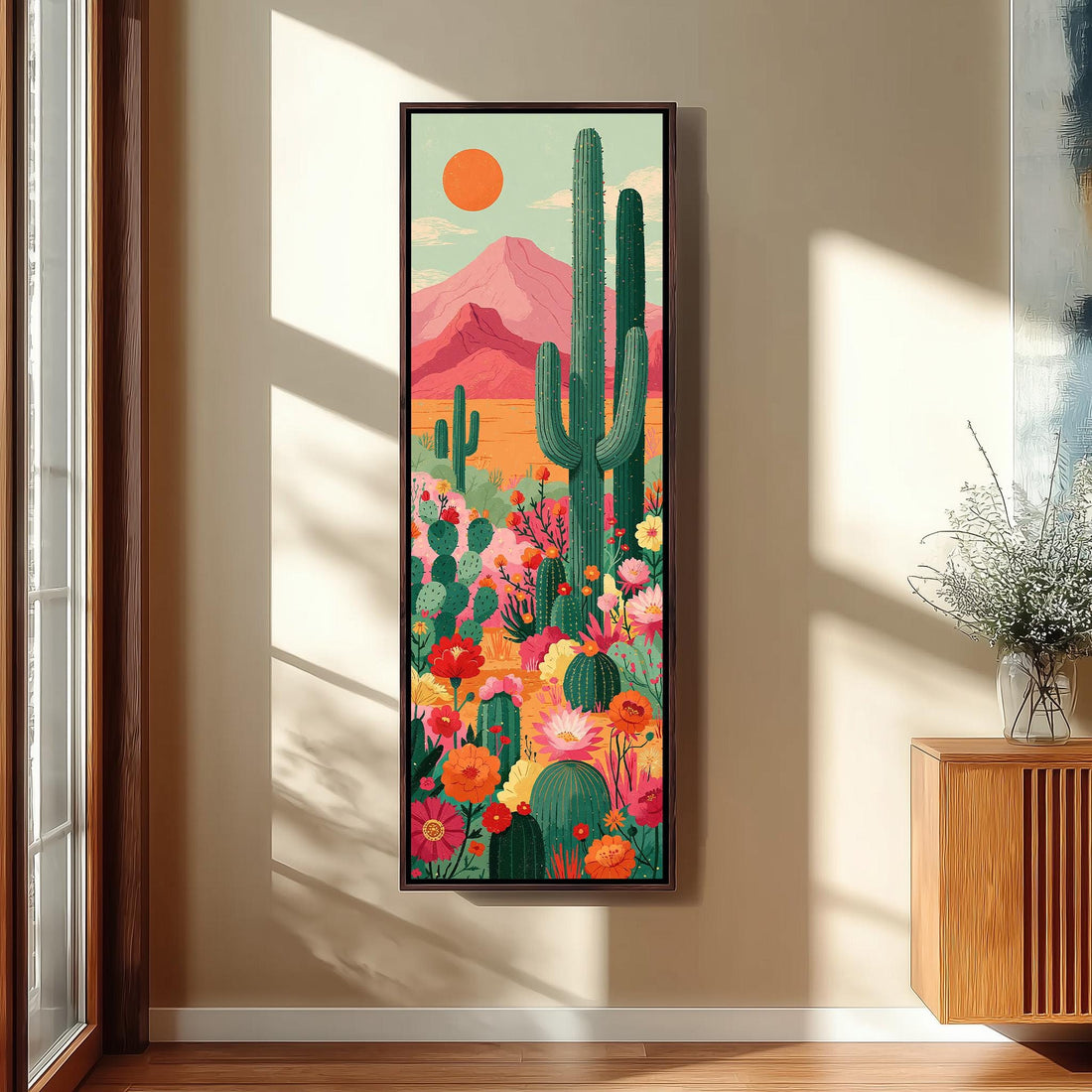 Cacti and flowers under a pink mountain long vertical canvas print in a sunlit living space