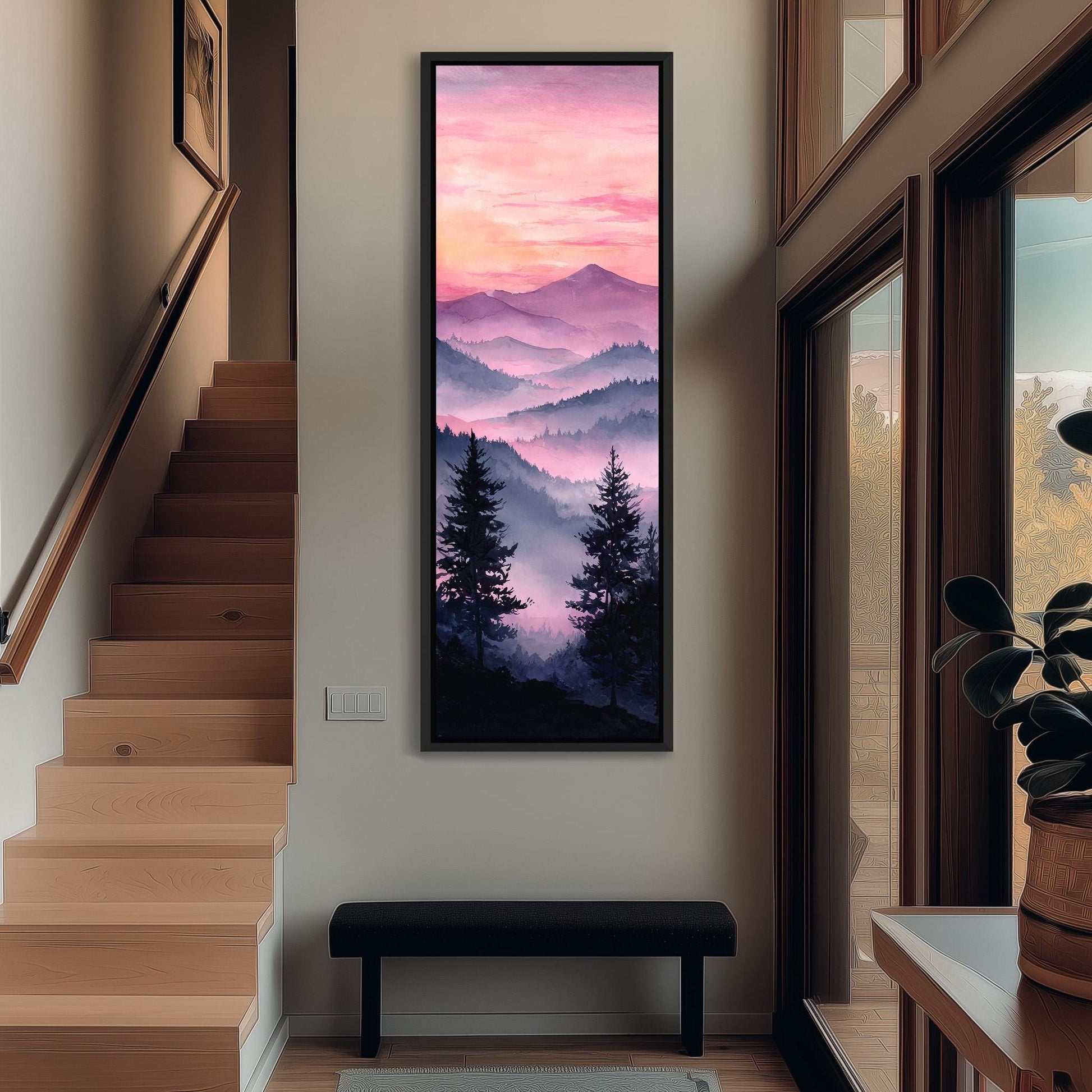 a large, framed painting of a mountain landscape with a colorful sunset sky, hanging on the wall of a hallway.