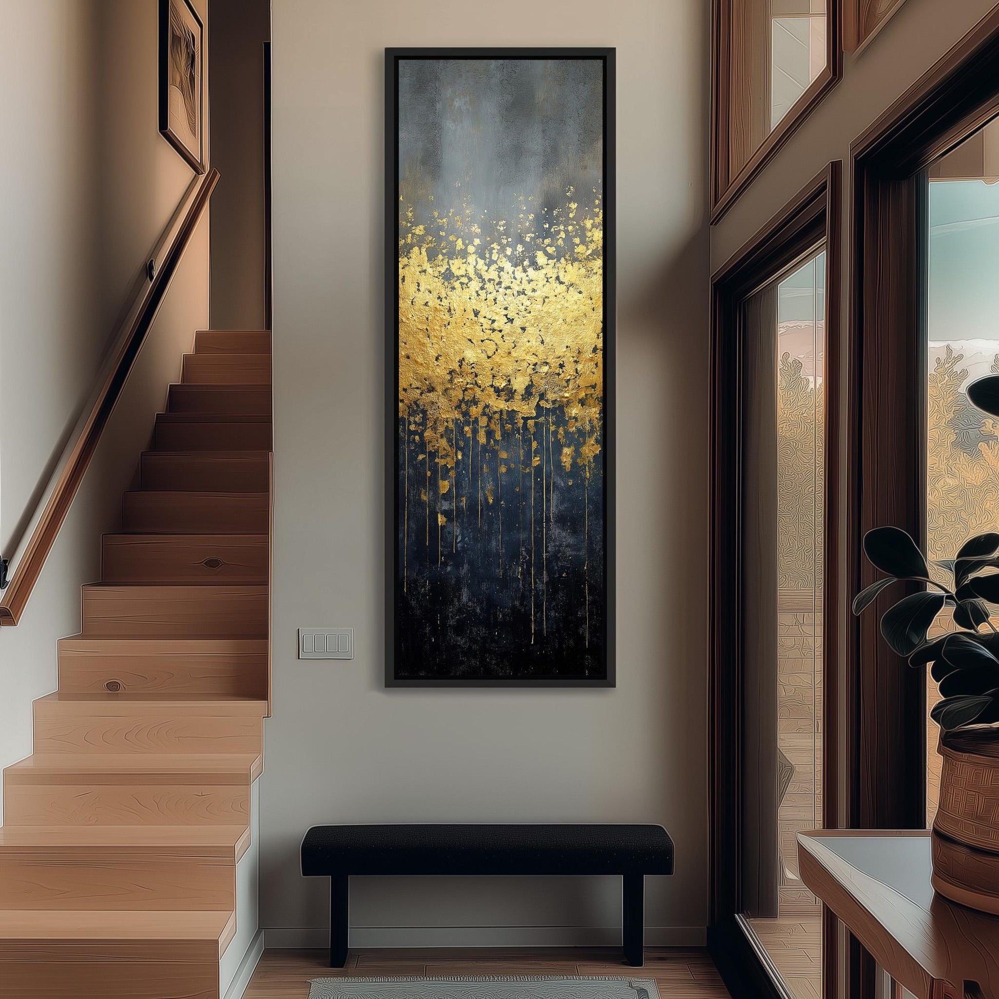 a modern and minimalist interior design with a large painting of yellow flowers hanging on the wall above a black bench. The painting is framed in black and is the focal point of the room. The room also includes a staircase, a window, and a plant, creating a serene and inviting atmosphere.