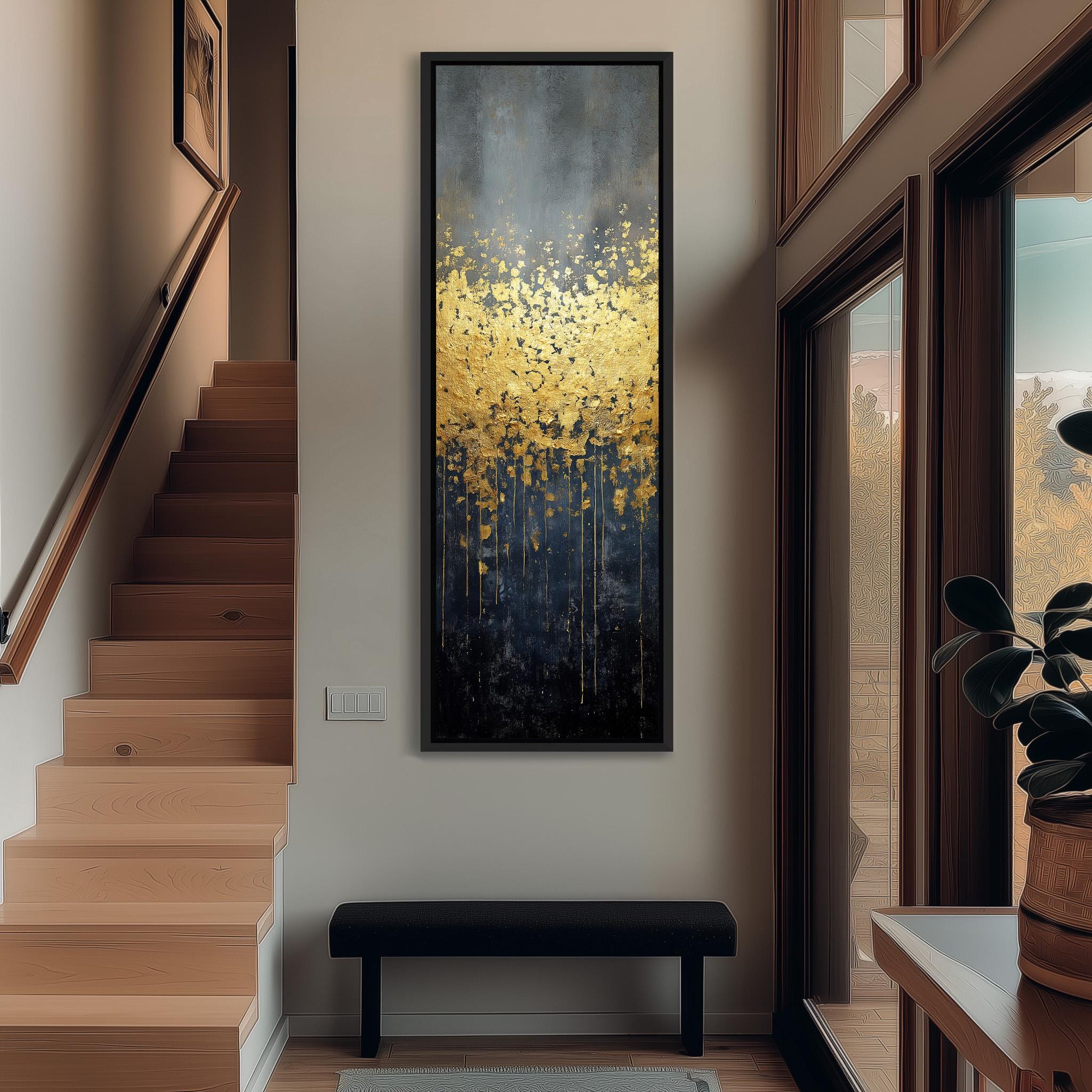 a modern and minimalist interior design with a large painting of yellow flowers hanging on the wall above a black bench. The painting is framed in black and is the focal point of the room. The room also includes a staircase, a window, and a plant, creating a serene and inviting atmosphere.