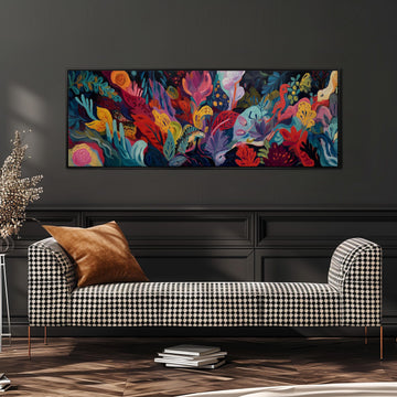 a large, colorful painting of a tropical garden hanging on a wall above a black and white checkered sofa.