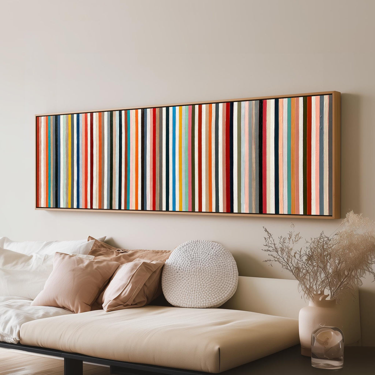 Rainbow pinstripes panoramic canvas print above a sofa in a living room