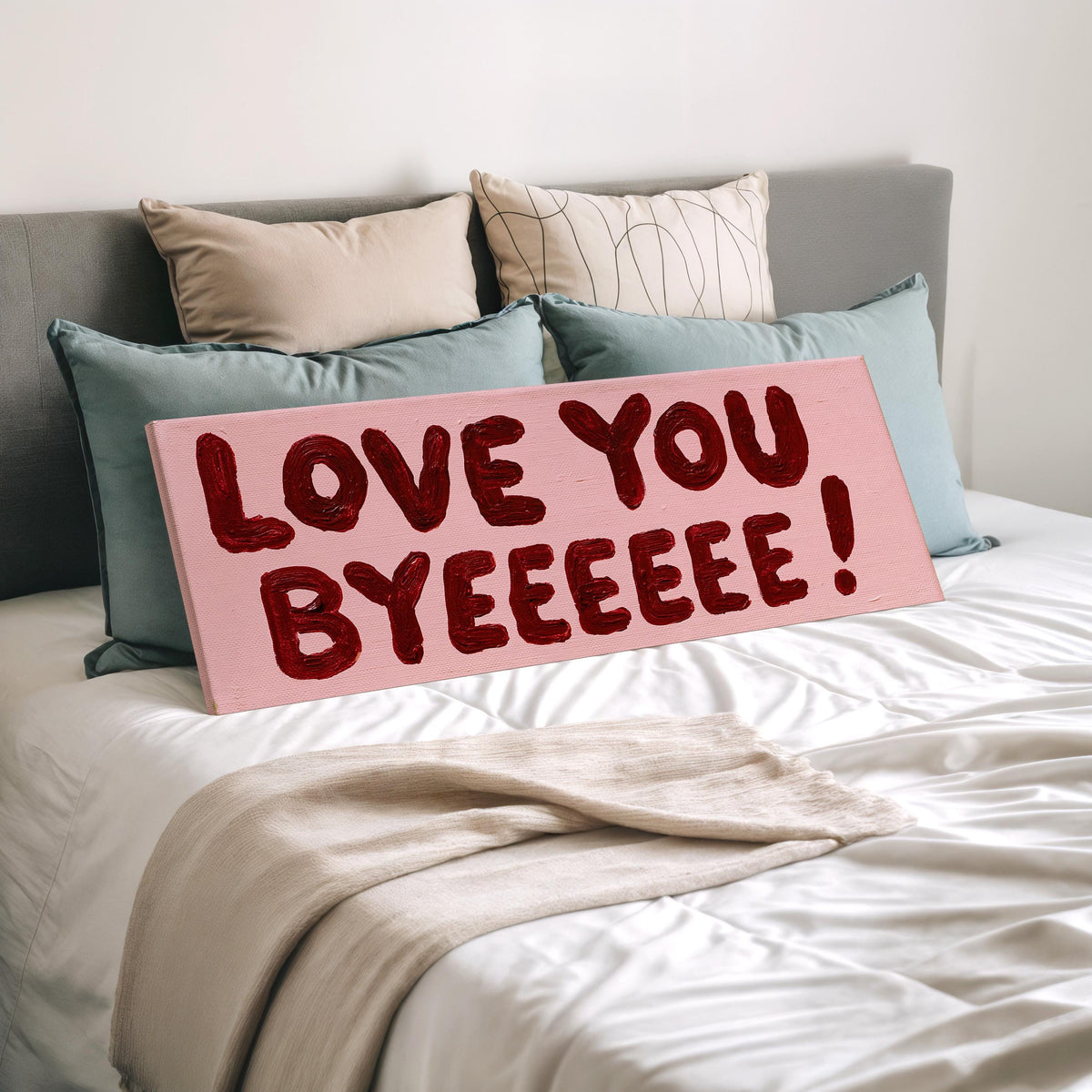 Love you byeeeee retro quote wide panoramic canvas print laid on a bed to show its size