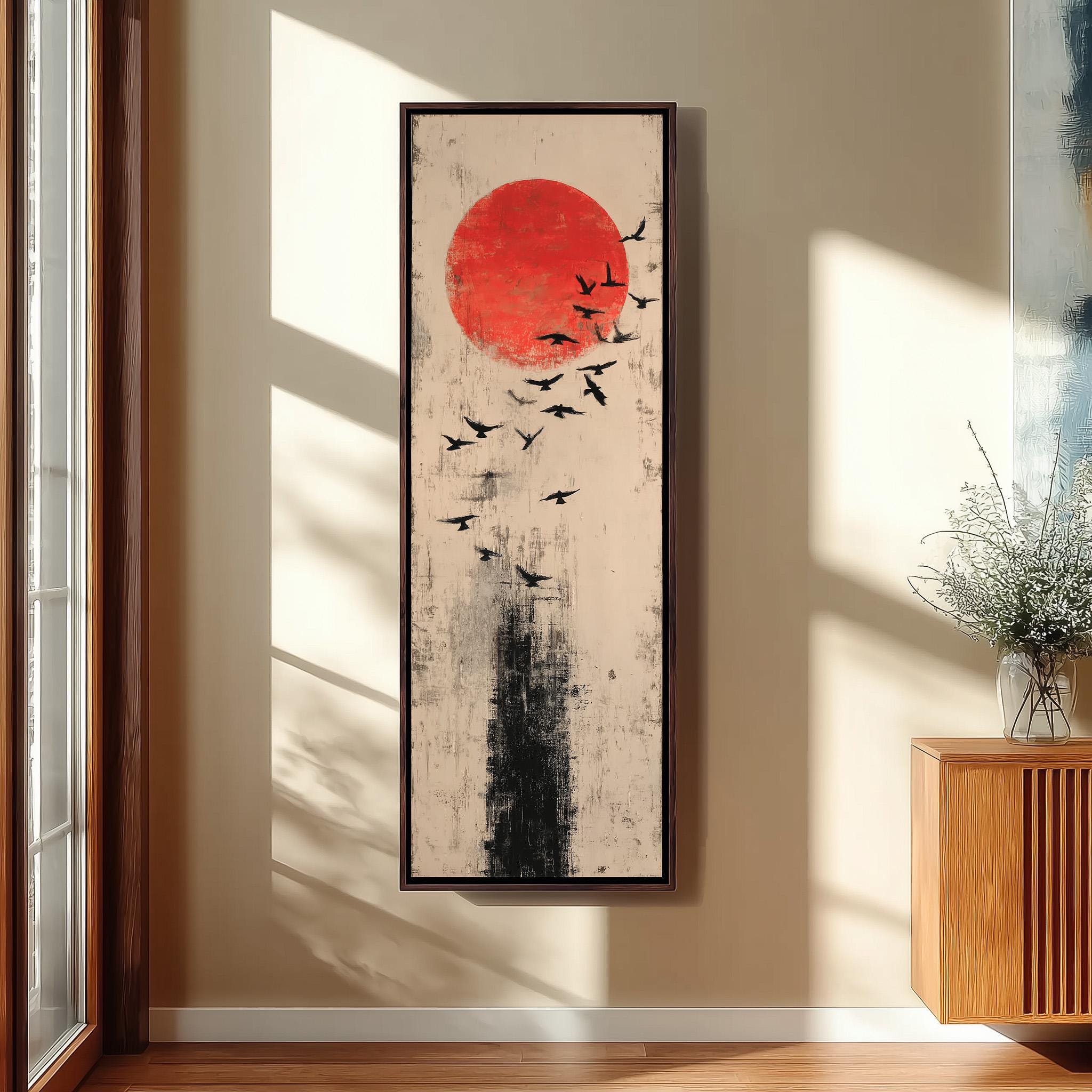 a large abstract painting hanging on a wall, depicting a flock of birds flying in front of a red sun.