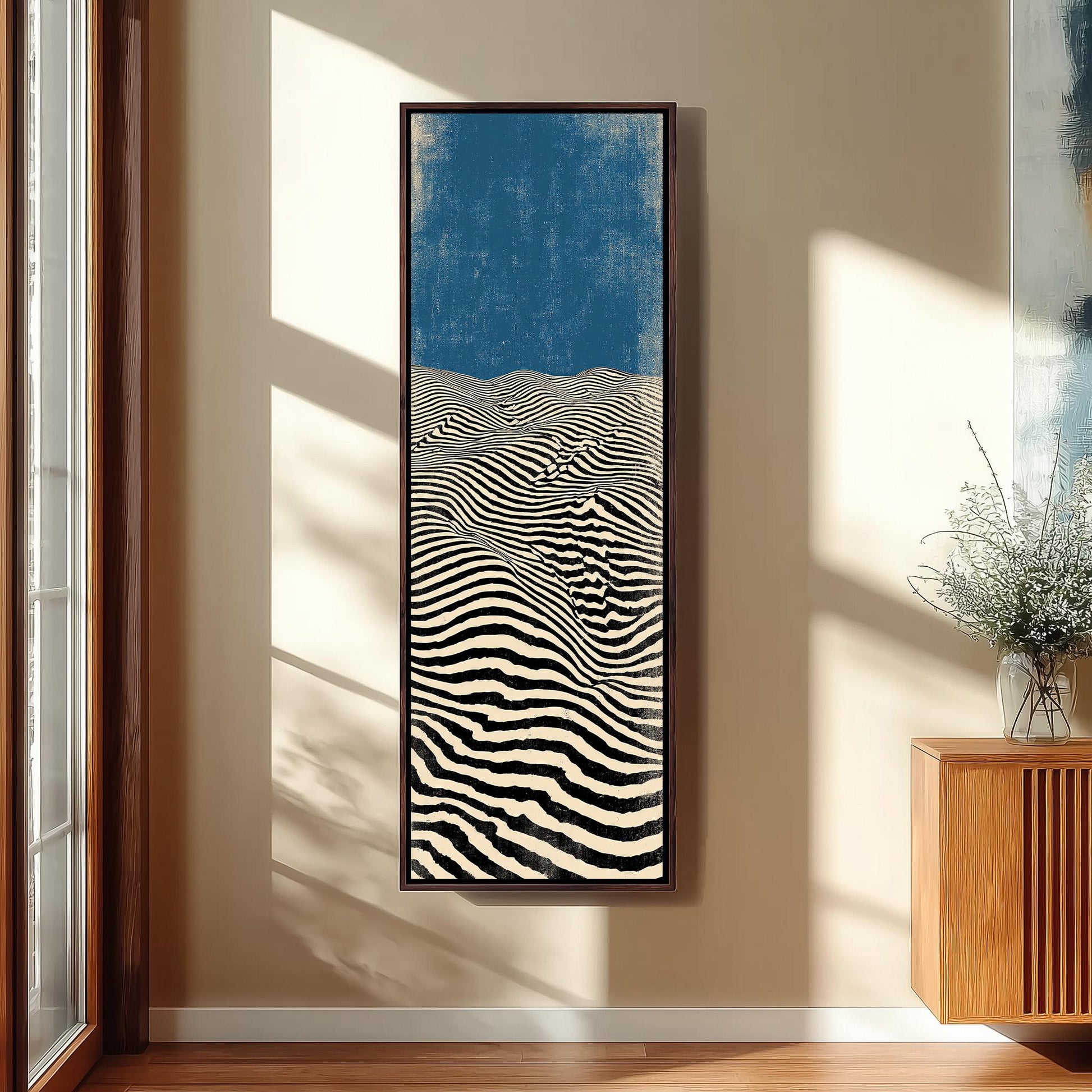 a large, abstract painting hanging on a wall, depicting a striking black and white striped pattern.