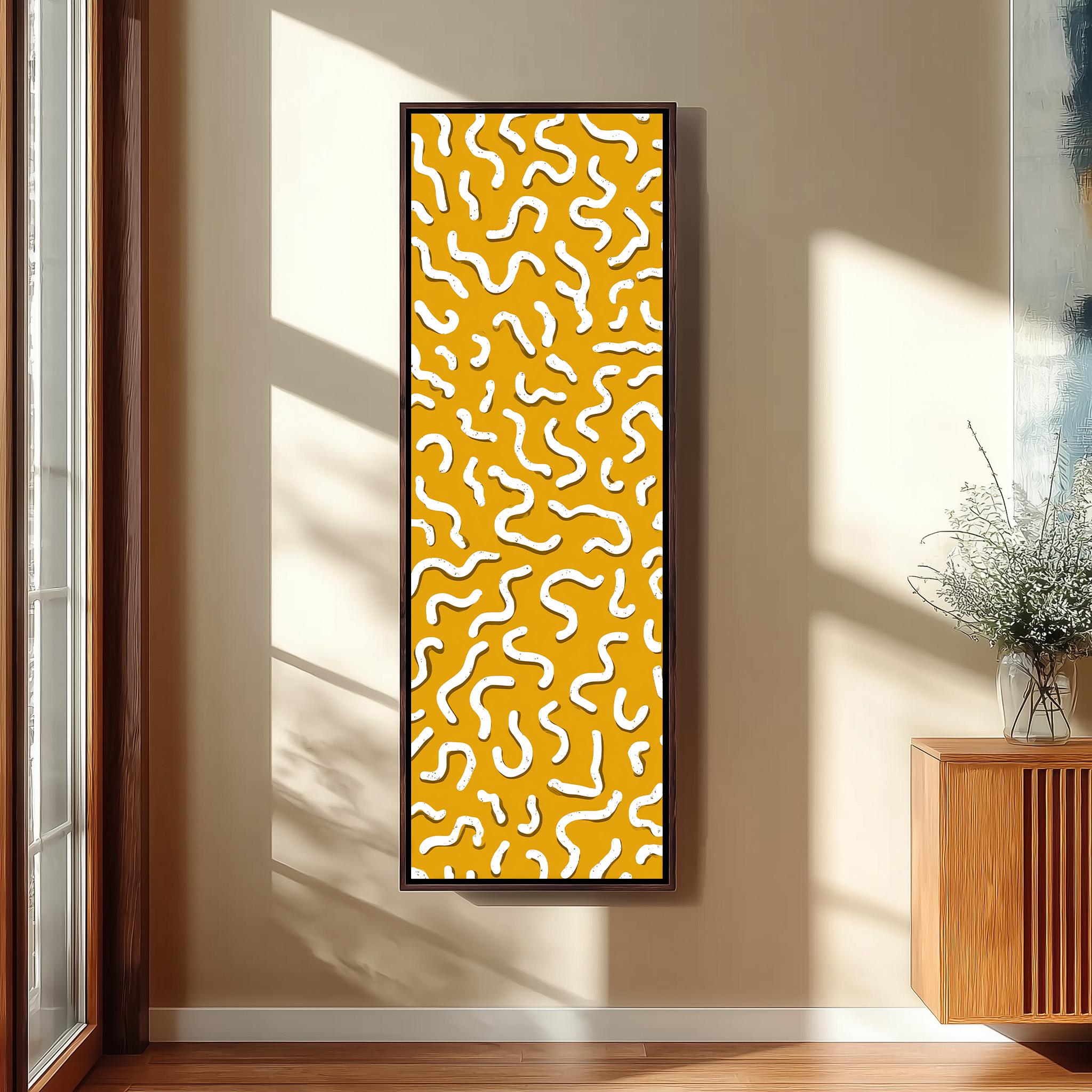 a large, abstract painting with a yellow and white color scheme, hanging on a wall in a room with a wooden cabinet and a vase of flowers.