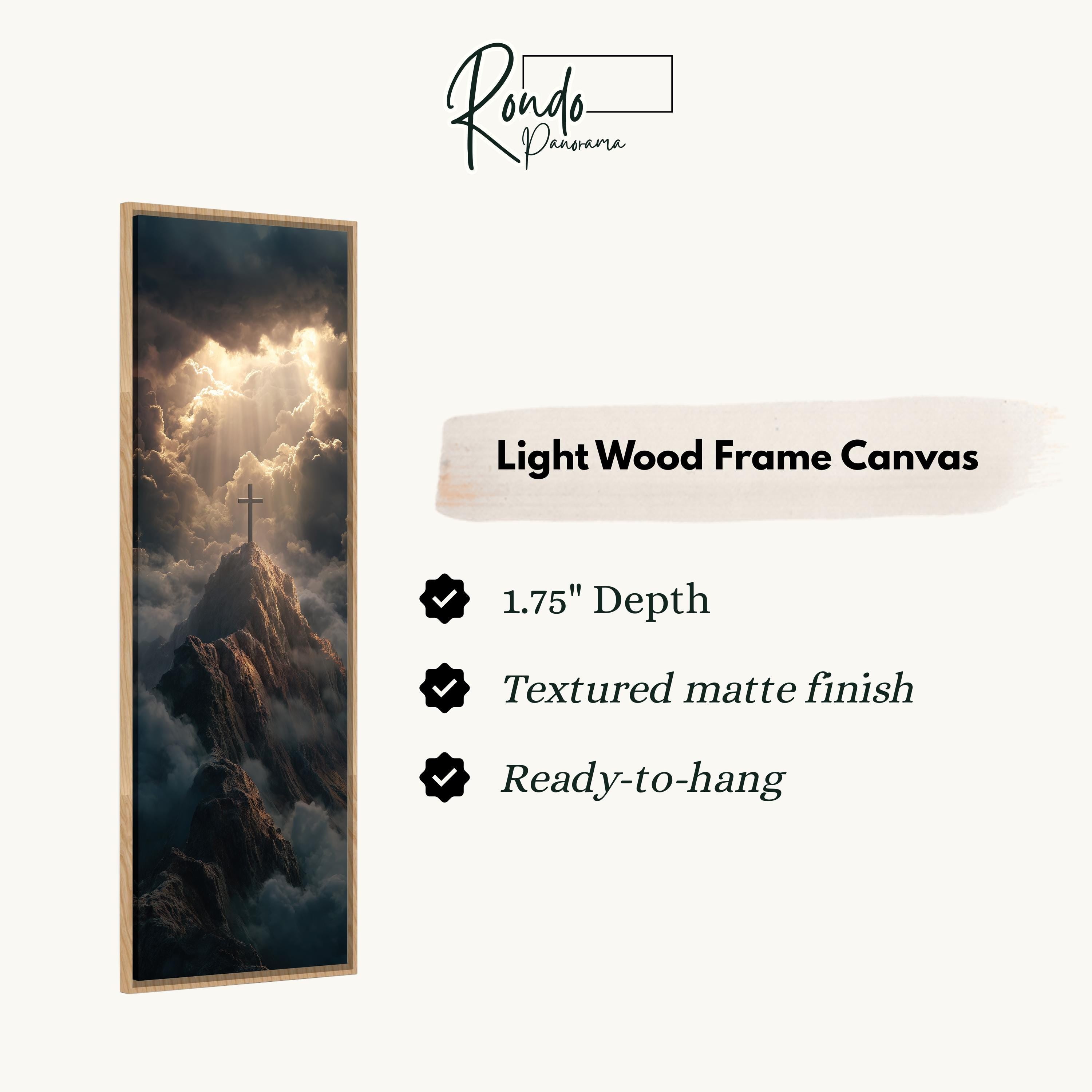 The image is a light wood frame canvas depicting a dramatic landscape with a cross on a mountain peak, surrounded by clouds and sunlight.