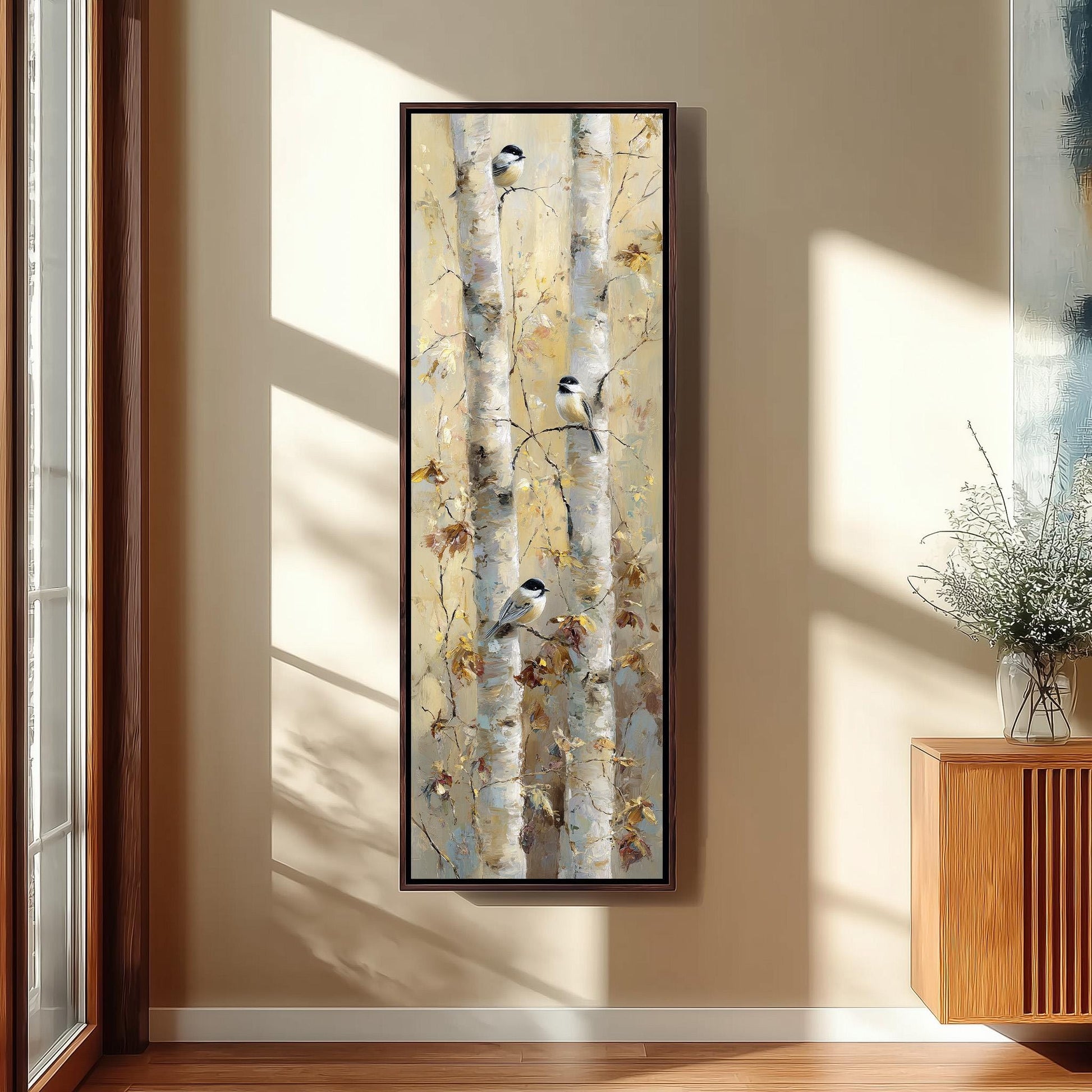 a large painting of birch trees hanging on a wall in a room with a wooden cabinet below it.