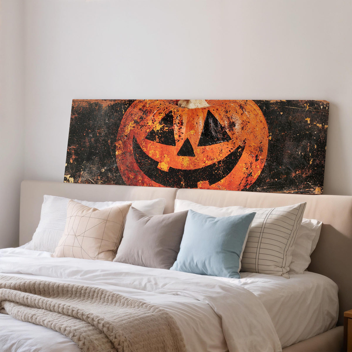 Rustic distressed jack-o'-lantern wide panoramic canvas print above a bed in a bedroom