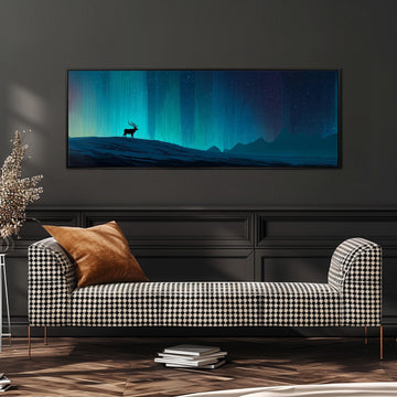 a large, framed painting of a deer standing on a hill against a night sky with a stunning display of the northern lights. The painting is hanging on a wall above a black and white checkered sofa, which is positioned in front of a stack of books.