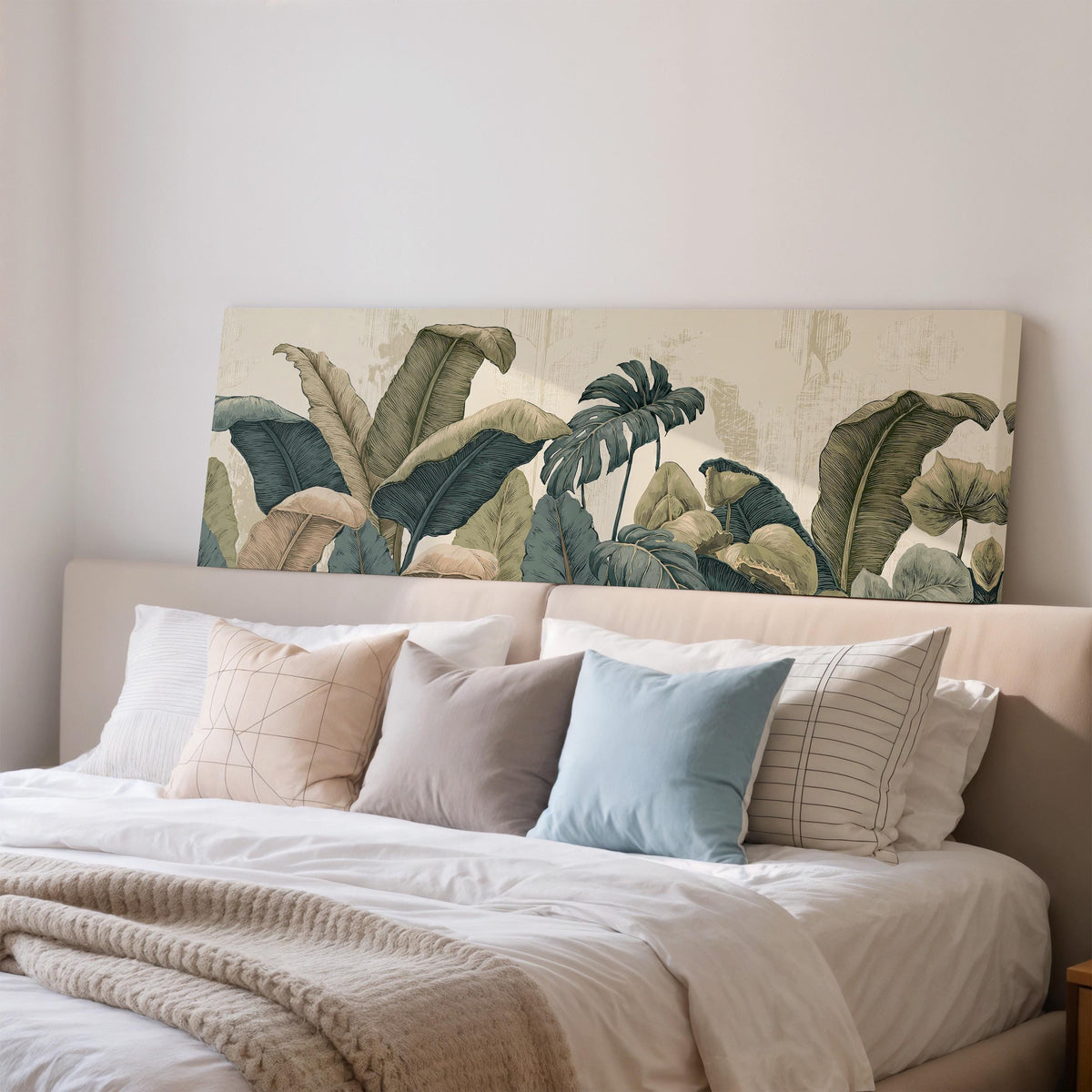Vintage tropical leaves wide panoramic canvas print above a bed in a bedroom
