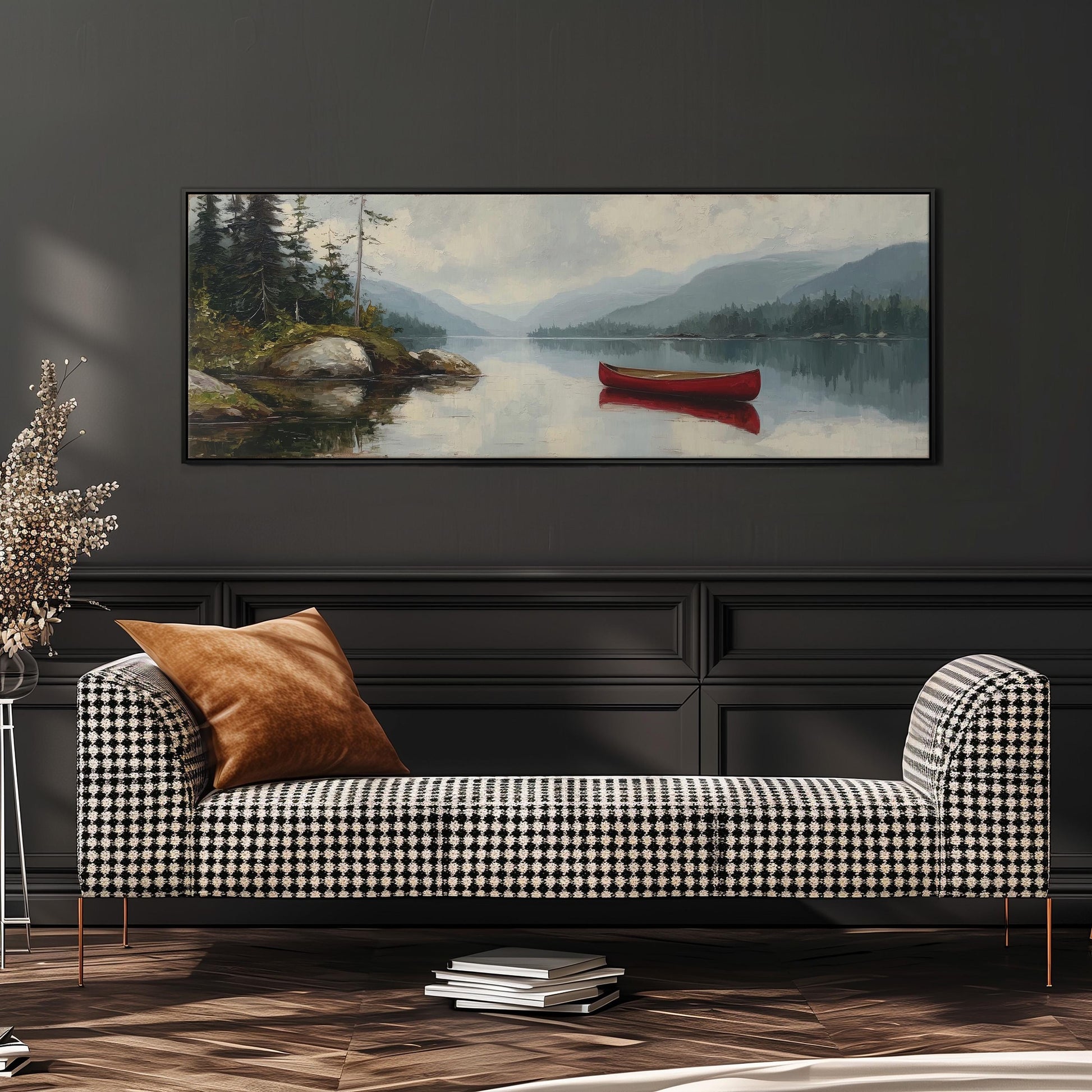 a large painting of a red canoe on a lake, hanging on a wall above a black and white checkered sofa.