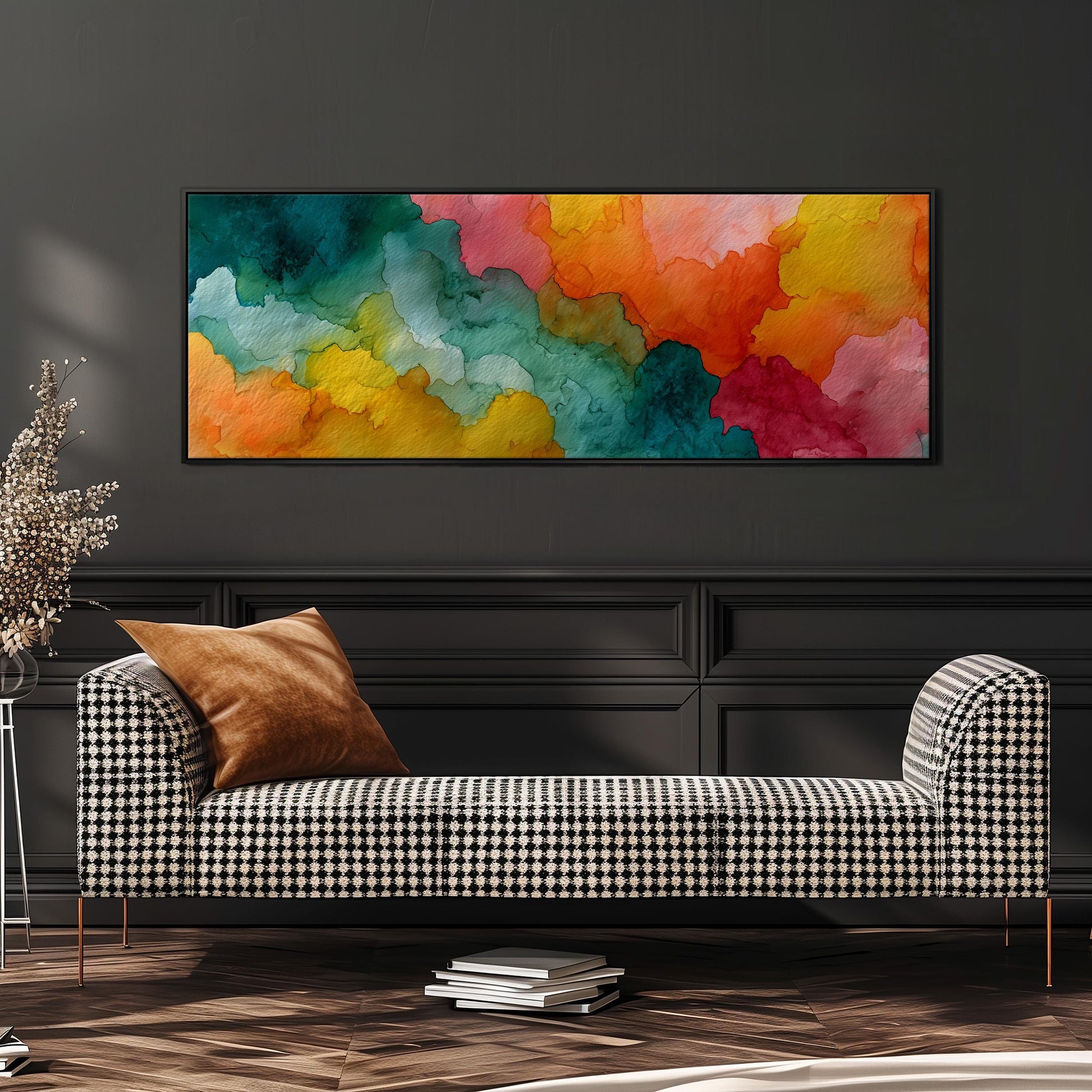 a checkered sofa with a vibrant abstract painting hanging above it on a dark wall.