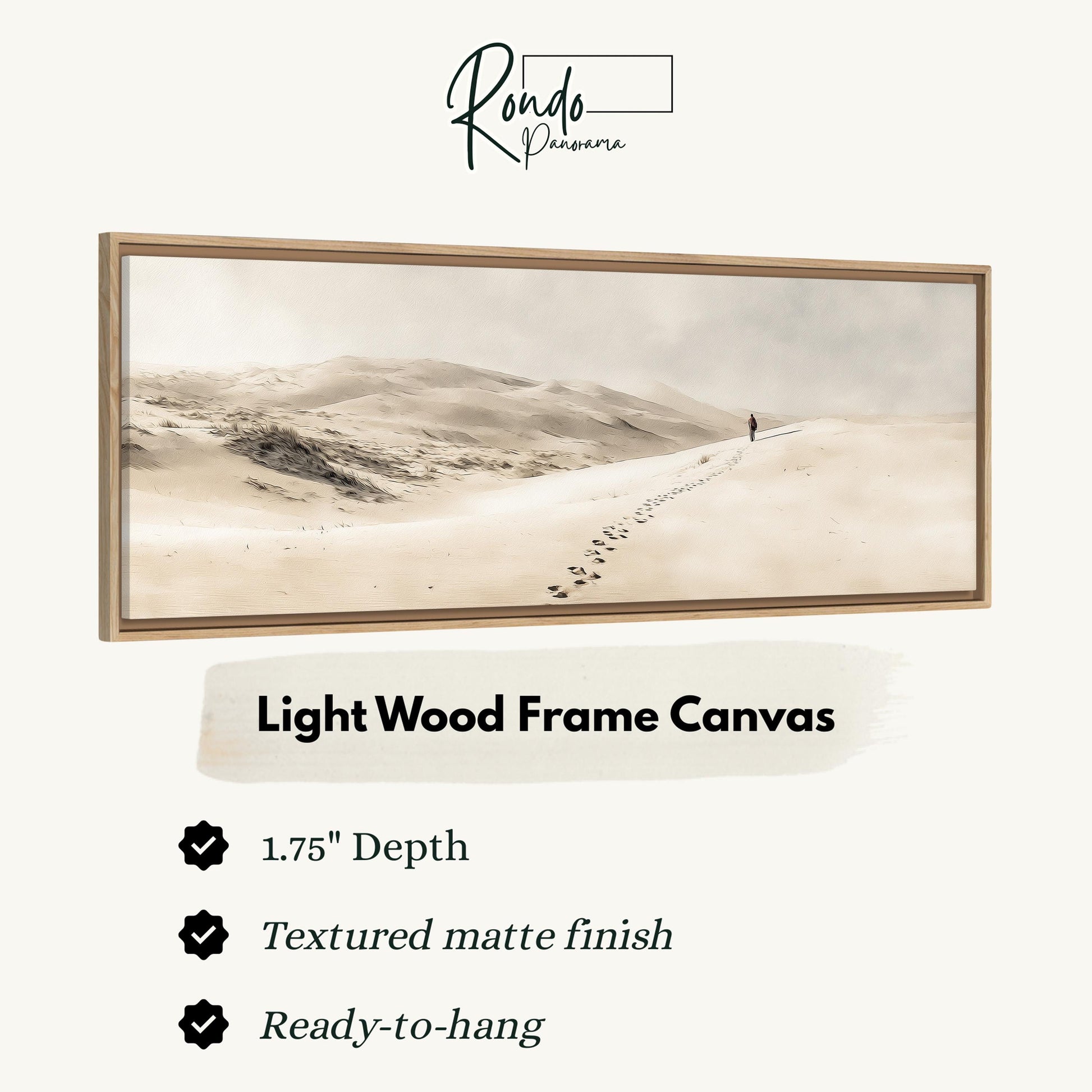 The image is a light wood frame canvas depicting a lone figure walking along a path in a desert landscape.
