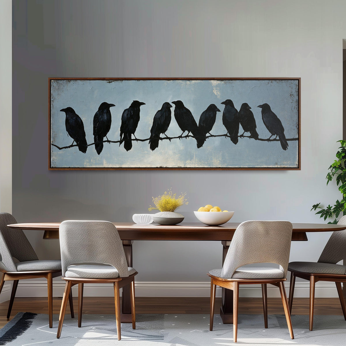 Crows gathered on a branch long horizontal canvas print above a dining table