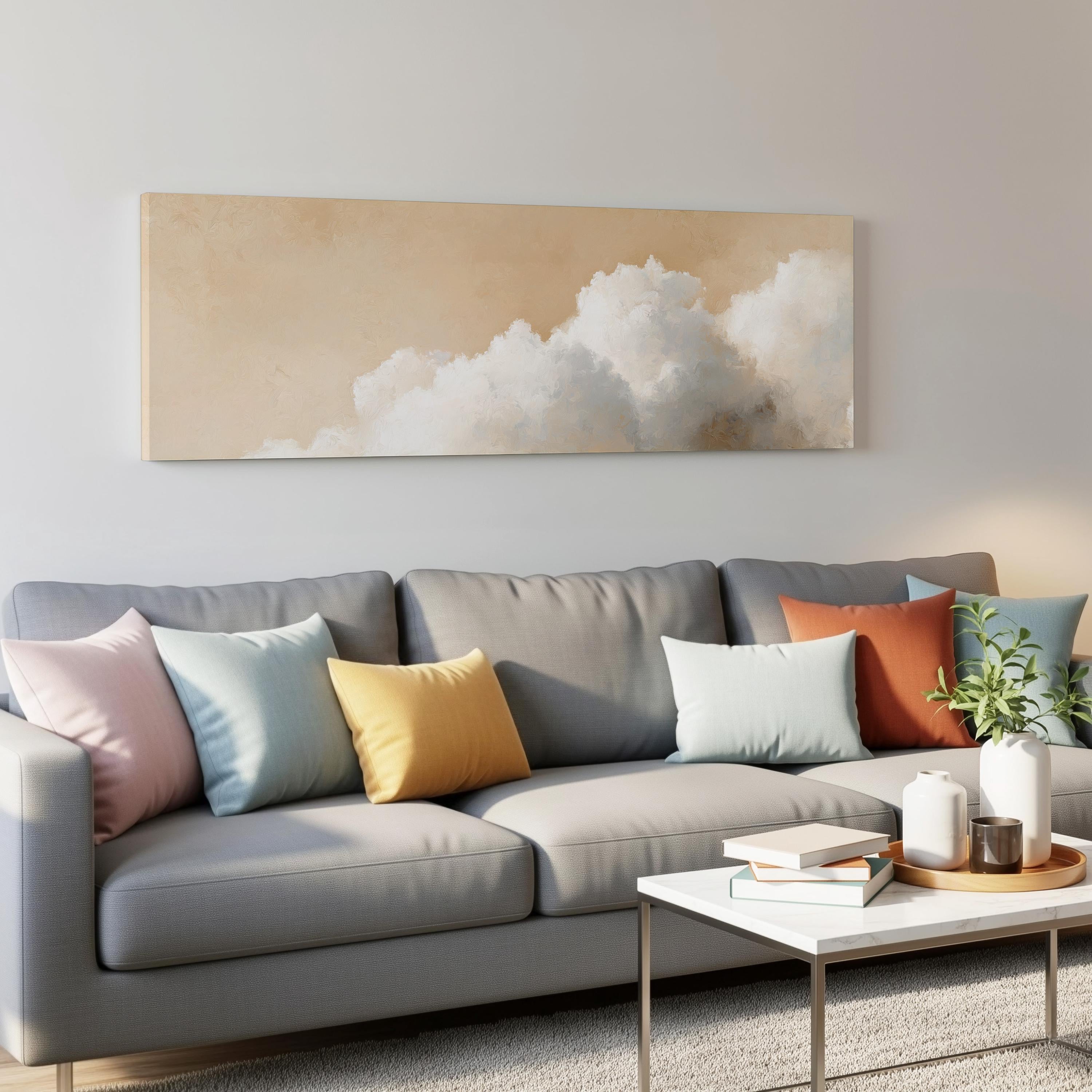a modern living room with a gray sofa adorned with colorful throw pillows, a white coffee table, and a framed artwork depicting a cloud-filled sky on the wall above the sofa.