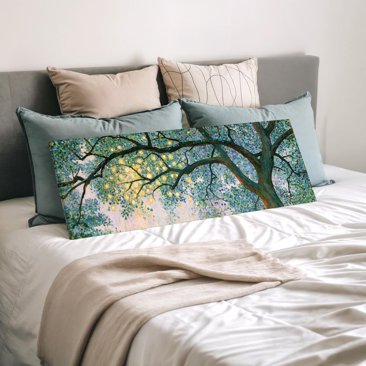 Tree canopy with golden light wide panoramic canvas print laid on a bed to show its size