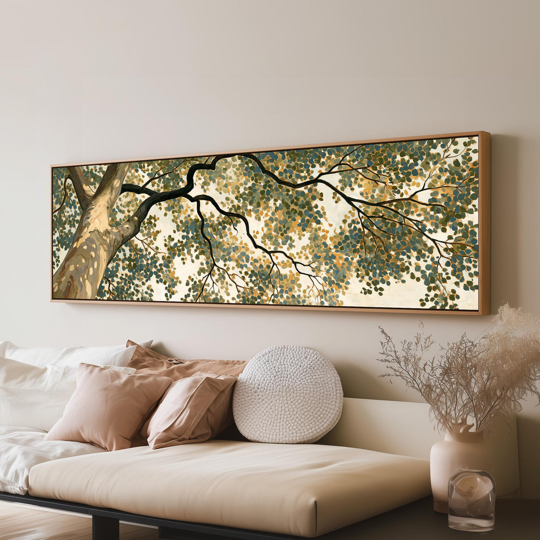 Dappled tree canopy seen from below long horizontal canvas print above a sofa in a living room