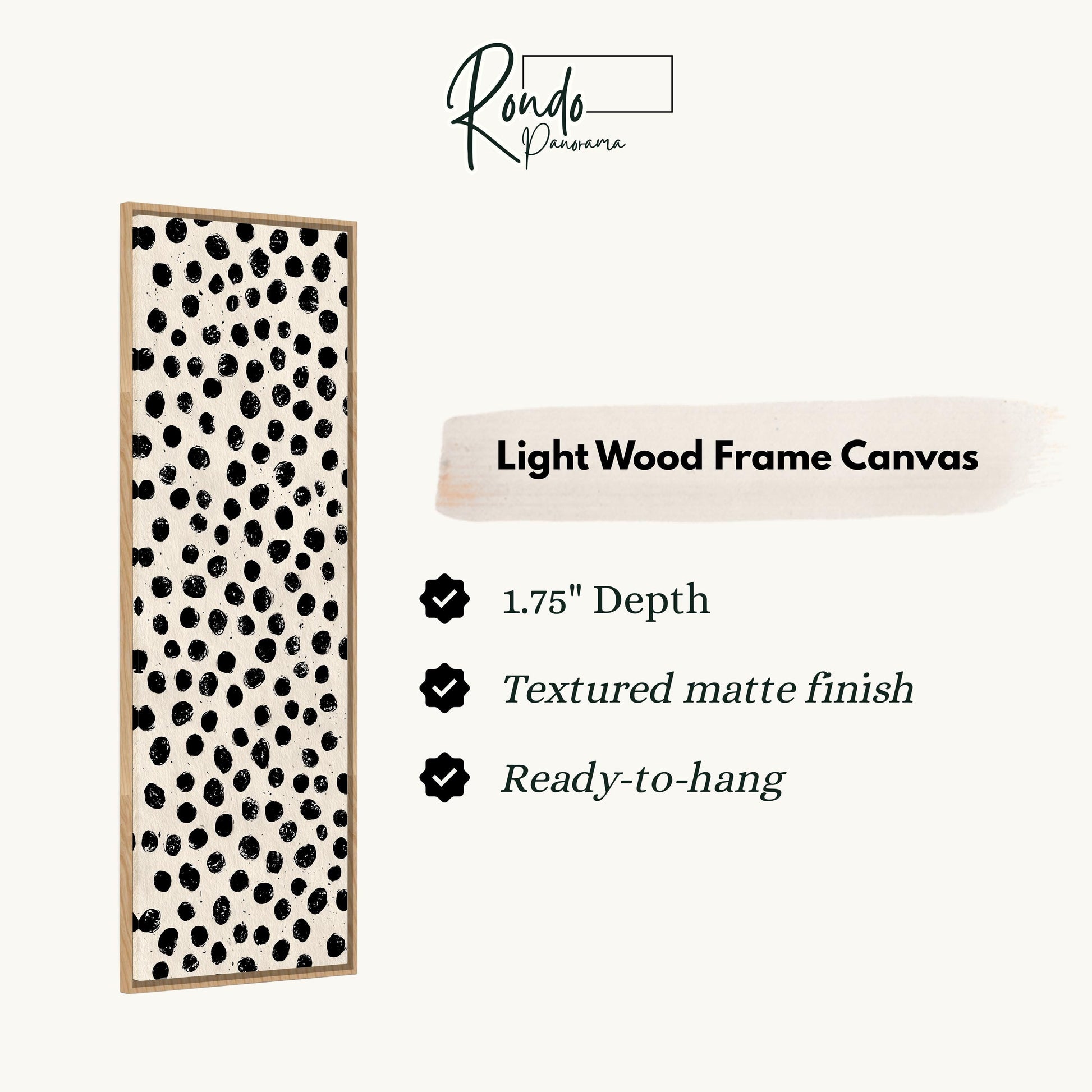 a light wood frame canvas with a black and white polka dot pattern.