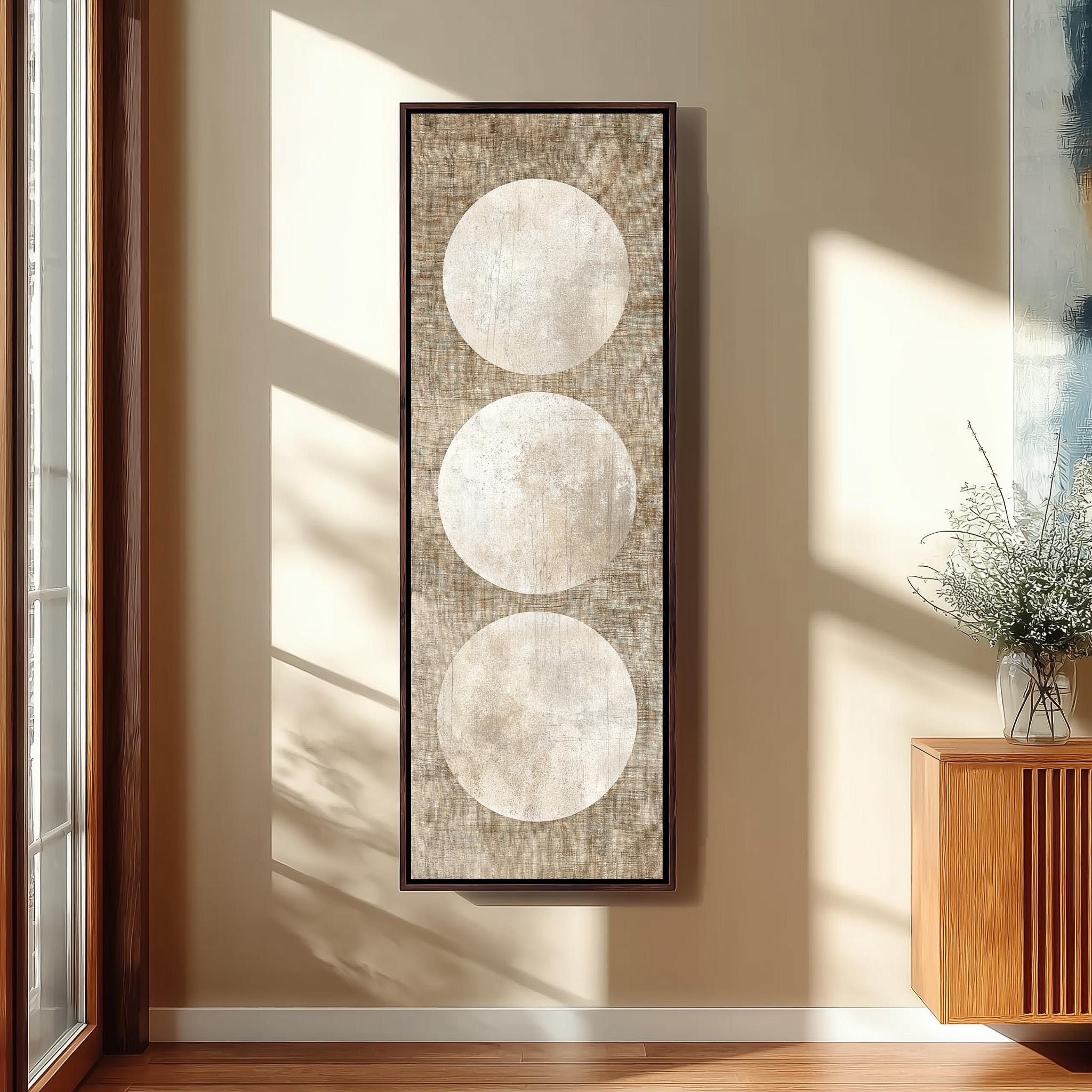 a large abstract painting hanging on a wall, with three white circles arranged in a vertical line. The painting is framed and appears to be the focal point of the room.