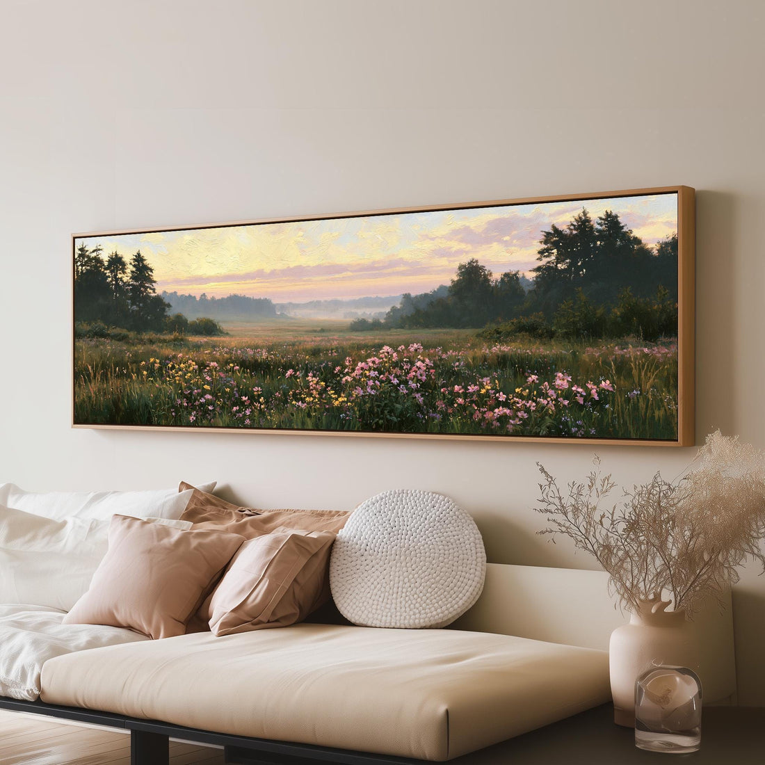 Pink wildflower hills at dusk long horizontal canvas print above a sofa in a living room