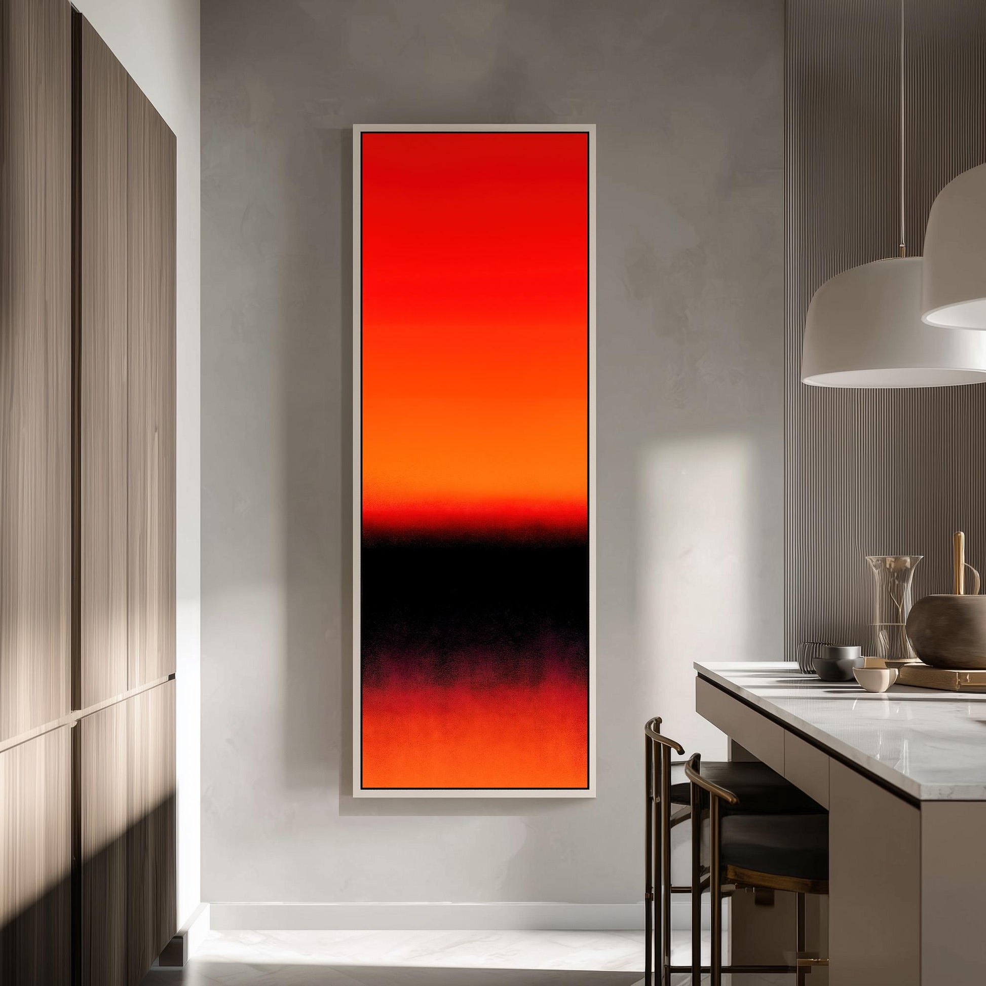 a modern kitchen with a large, vibrant abstract painting hanging on the wall. The painting has a gradient of red and orange colors, creating a striking visual contrast. The kitchen is well-lit, with natural light coming in from a window on the left side of the image. The countertop has a few items on it, including a vase and a bowl. The overall design of the kitchen appears to be contemporary and stylish.