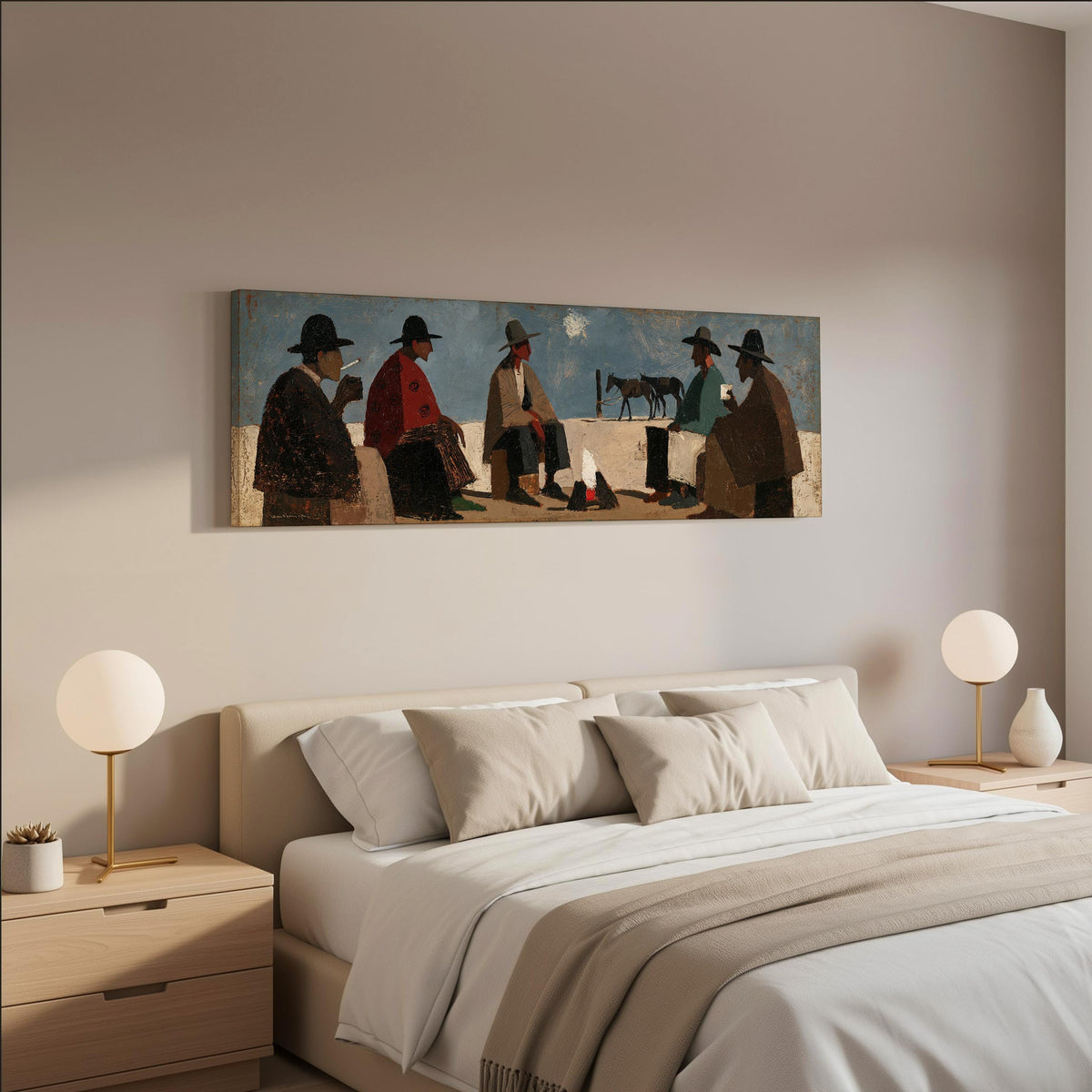 Cowboys gathered around a campfire wide panoramic canvas print above a bed in a neutral bedroom