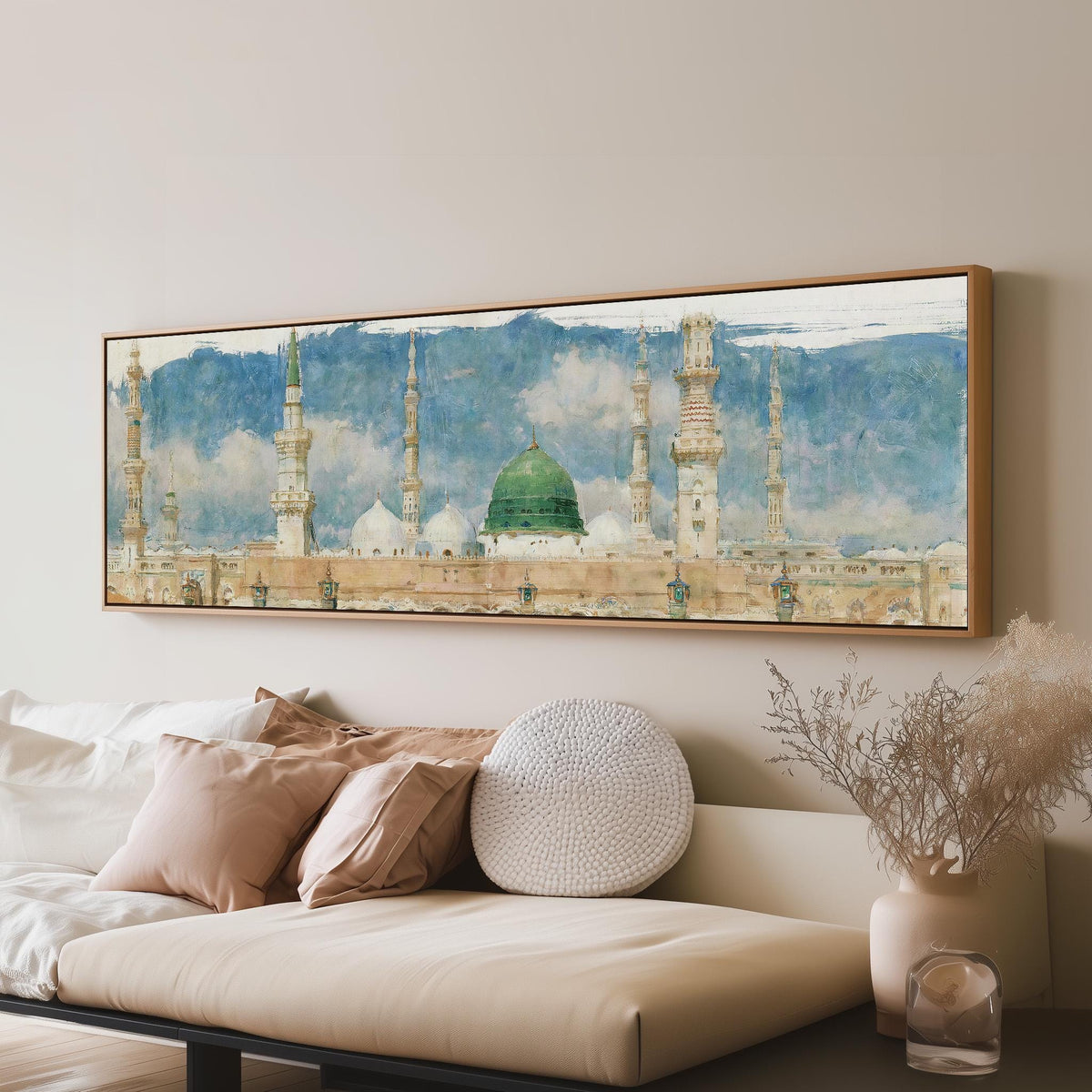 The green dome of the Prophet's Mosque in Medina long horizontal canvas print above a sofa in a living room