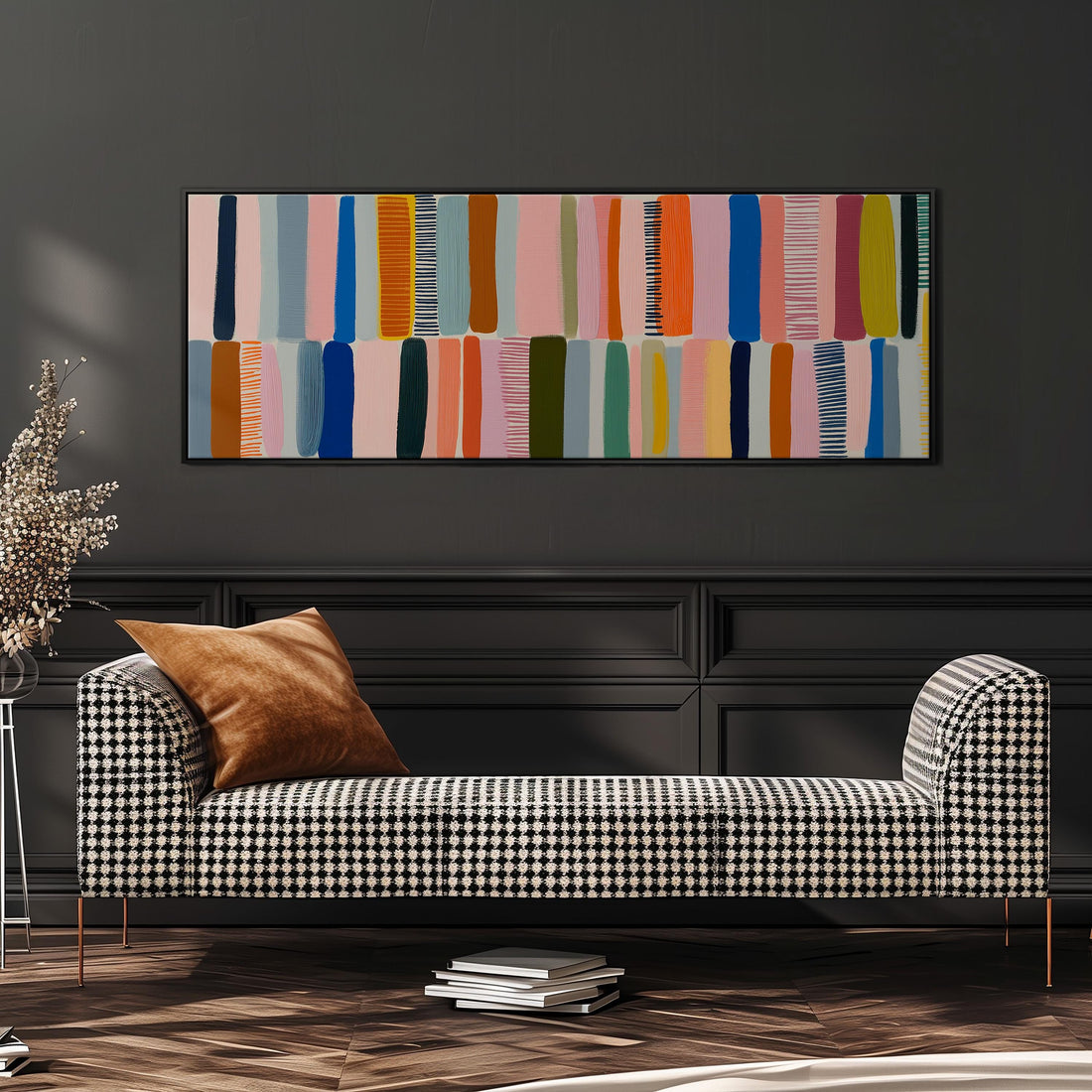 a large, colorful abstract painting hanging on a wall above a brown sofa.