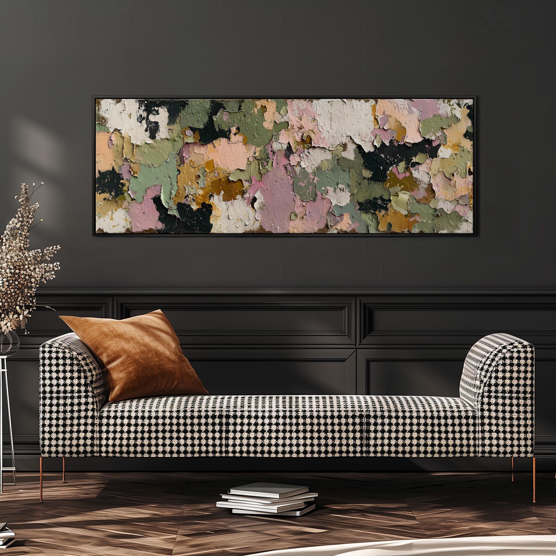 a black and white checkered sofa with a brown throw pillow, set against a dark wall with a large abstract painting hanging above it.