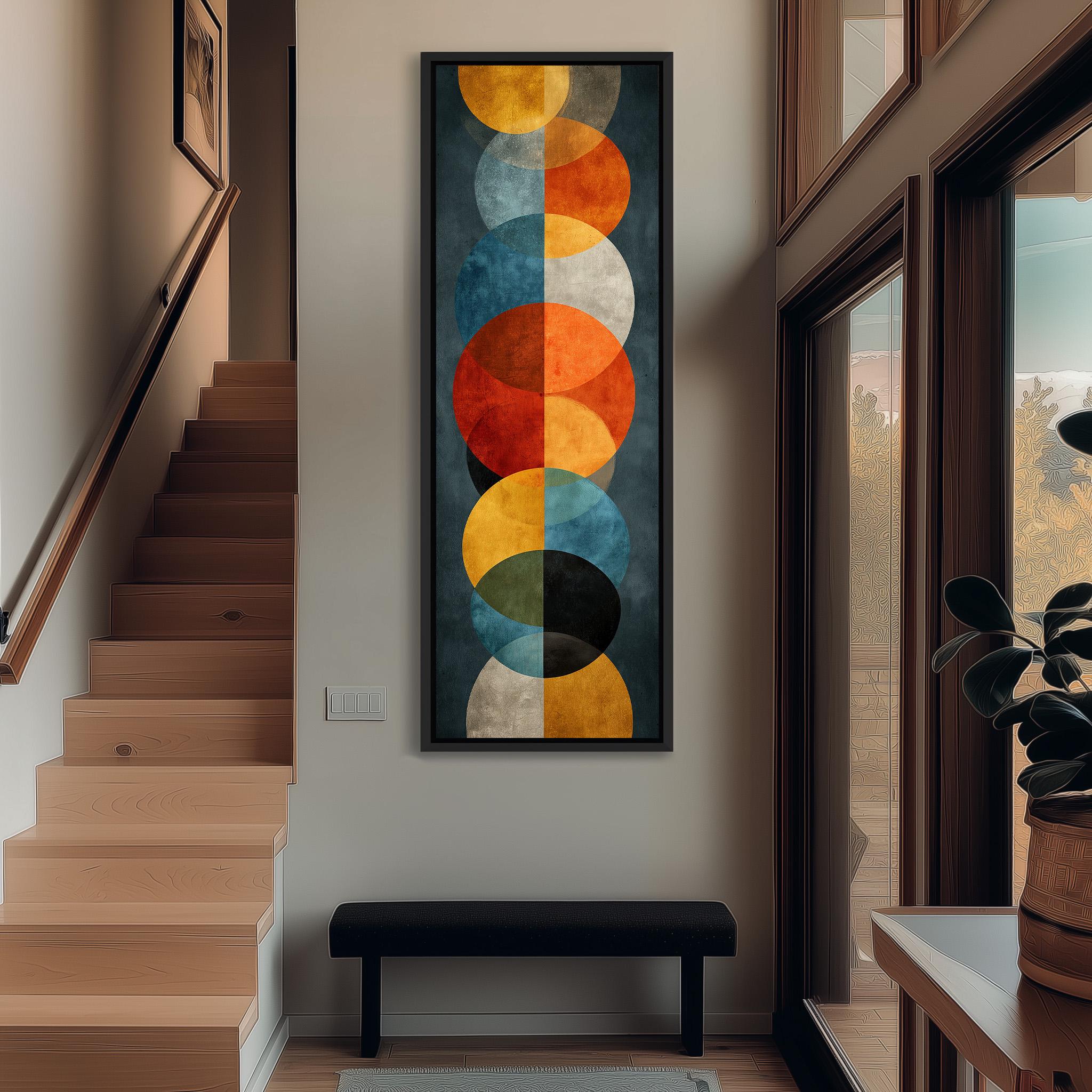 a modern and minimalist interior design with a large abstract painting hanging on the wall above a black bench. The painting consists of various circles in different sizes and colors, creating a visually striking and vibrant display. The room also includes a staircase, a potted plant, and a window, contributing to the overall contemporary aesthetic.