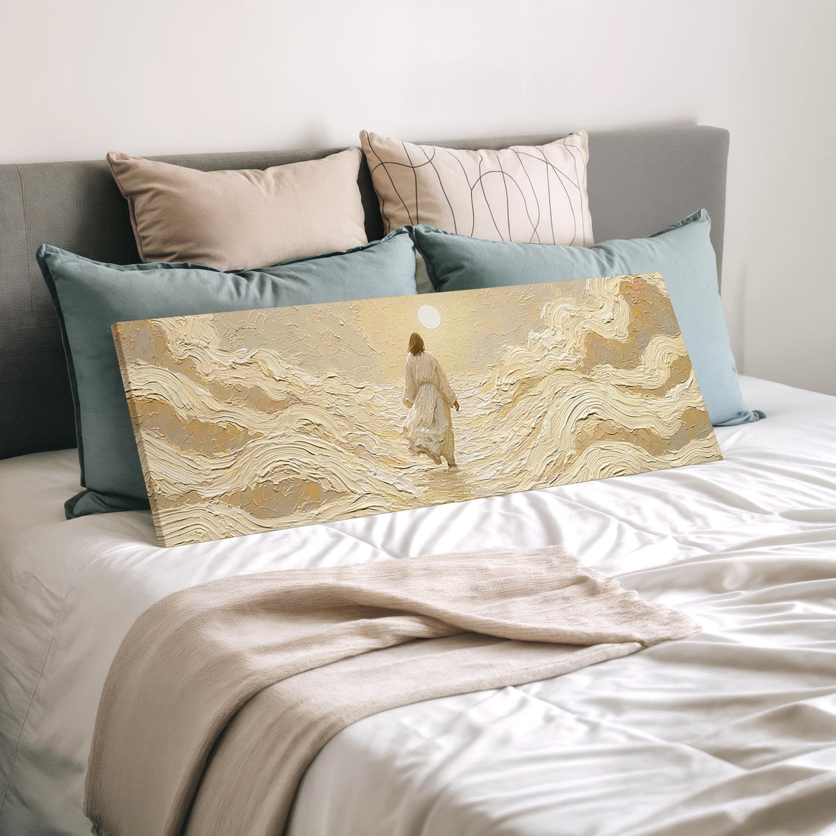 Jesus walking on golden waves wide panoramic canvas print laid on a bed to show its size