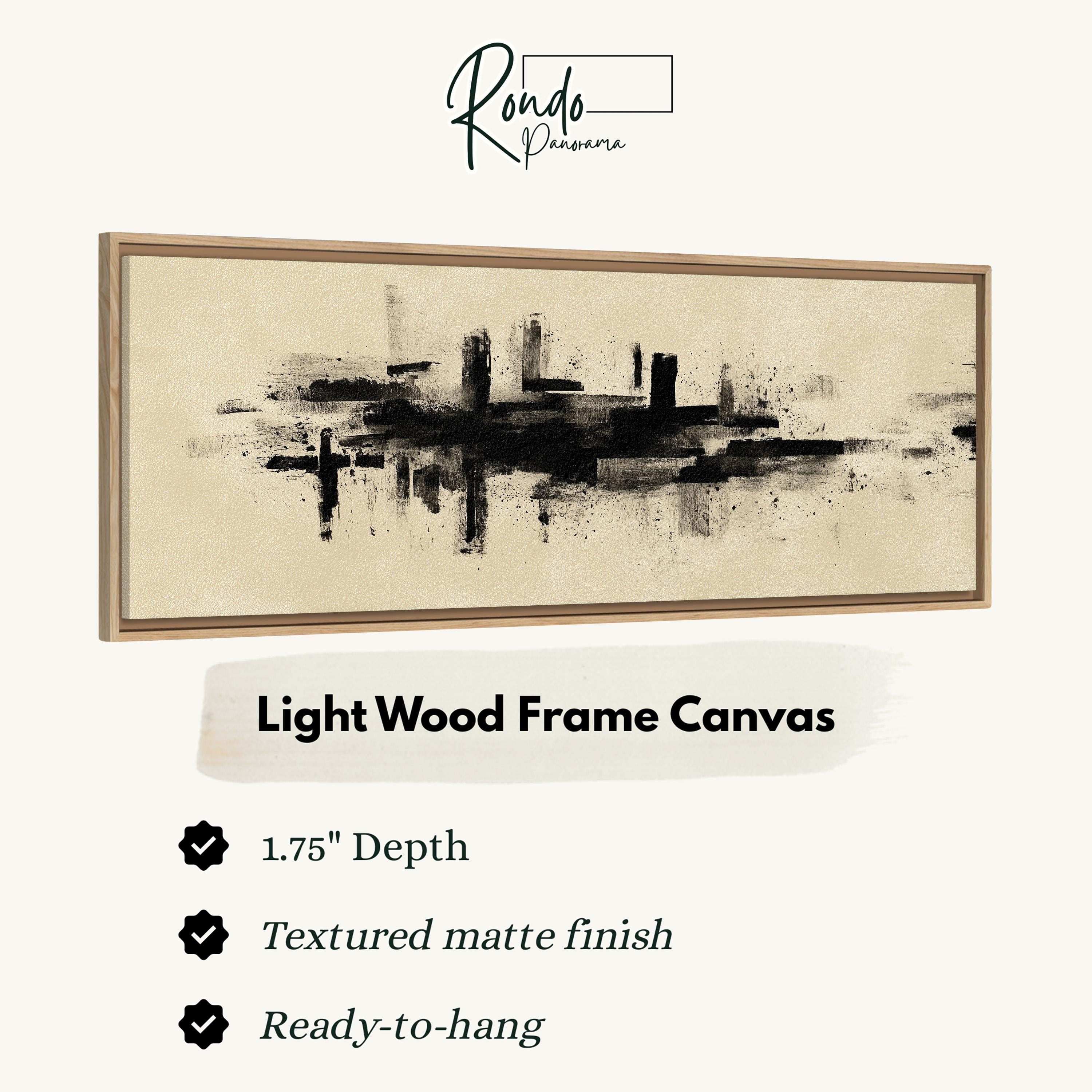 The image is a product advertisement for a light wood frame canvas. It features a black and white abstract painting of a city skyline, with a description of the product's features and benefits.